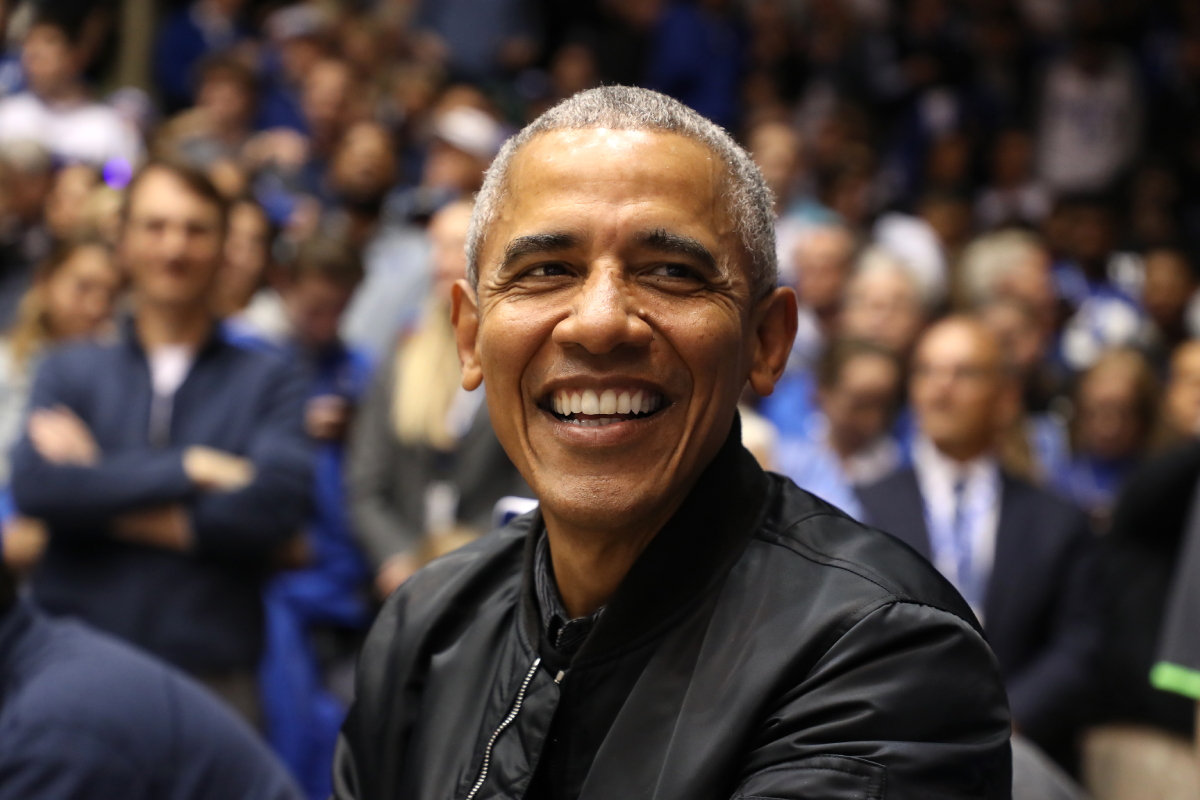 Barack Obama at an event wearing a dark colored jacket