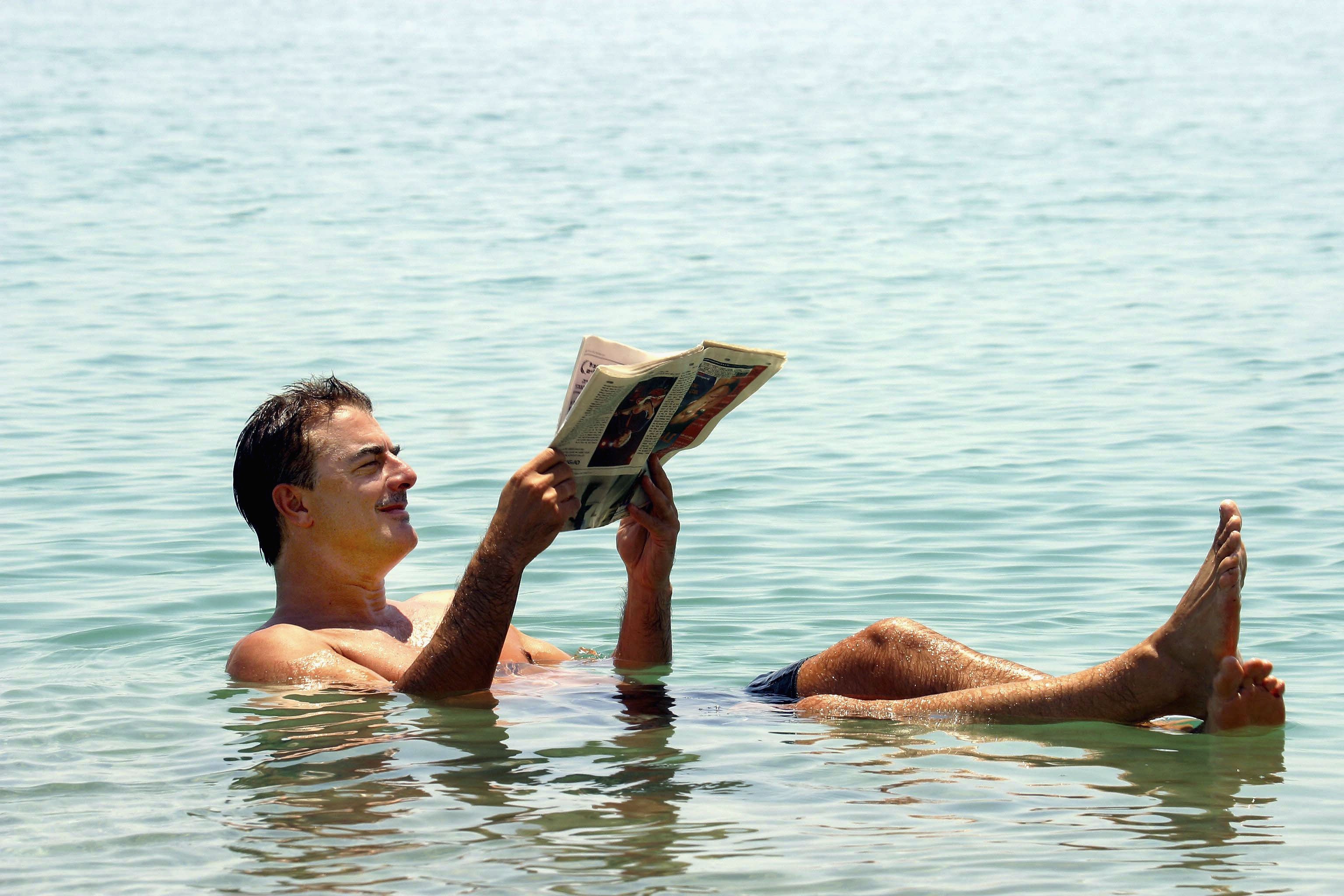 Chris Noth floats in the Dead Sea in 2004