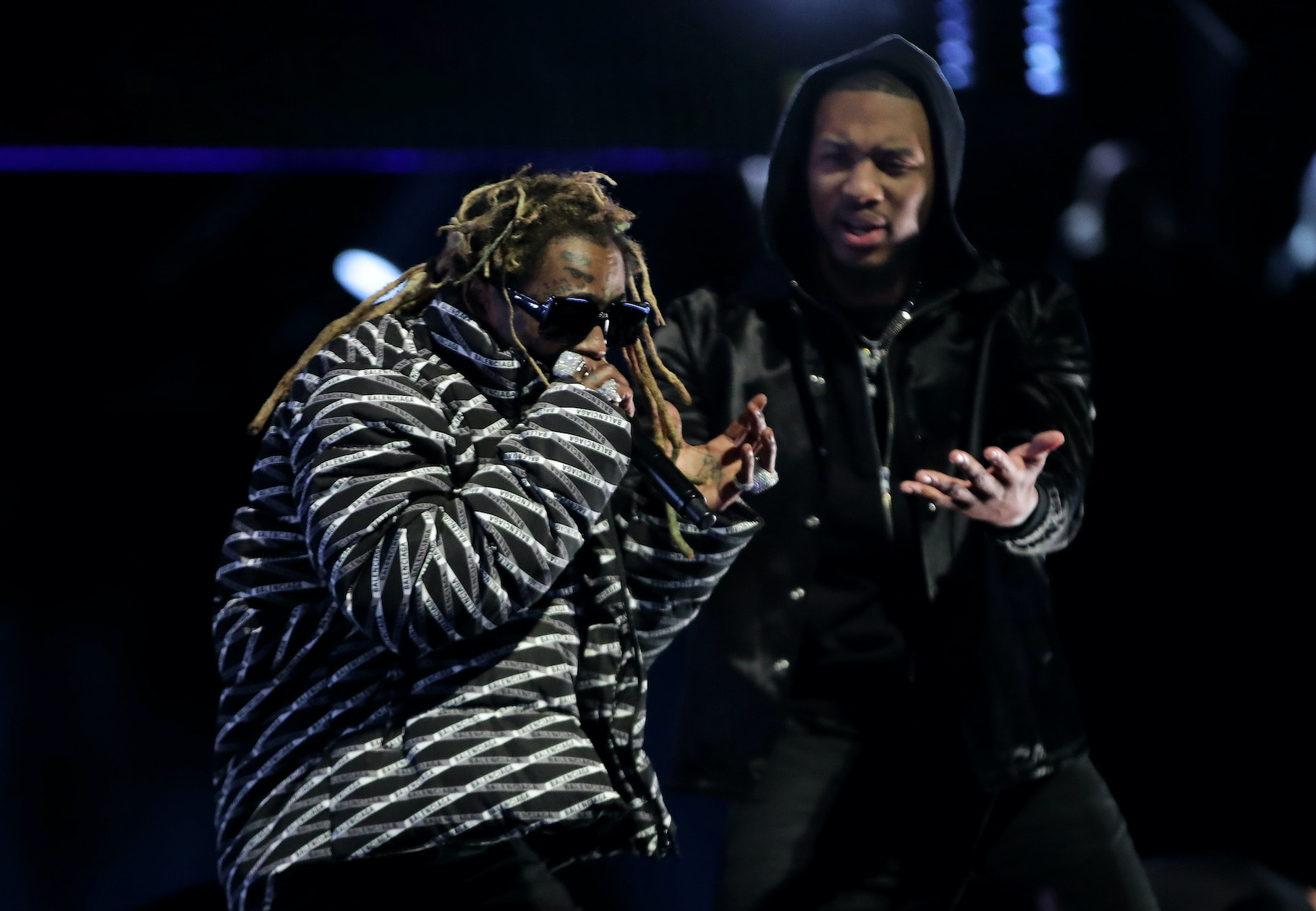 Lil Wayne performs with Damian Lillard in the 2020 NBA All-Star - AT&T Slam Dunk Contest during State Farm All-Star Saturday Night at the United Center