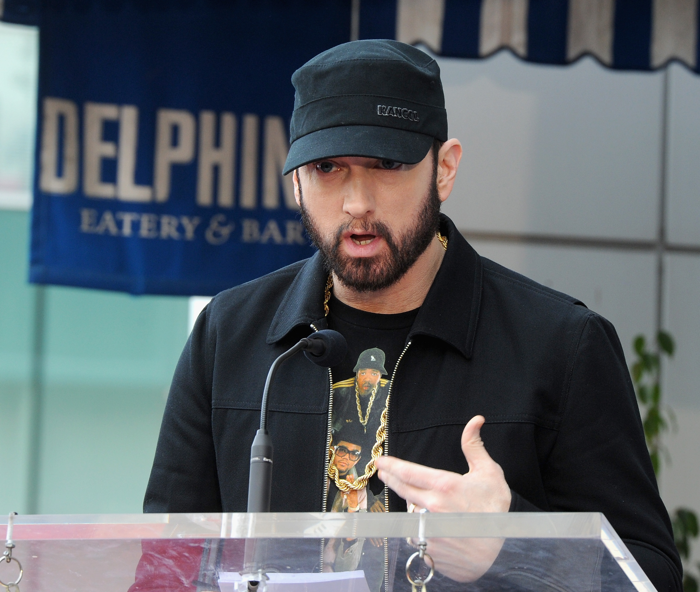 Eminem speaking at a ceremony