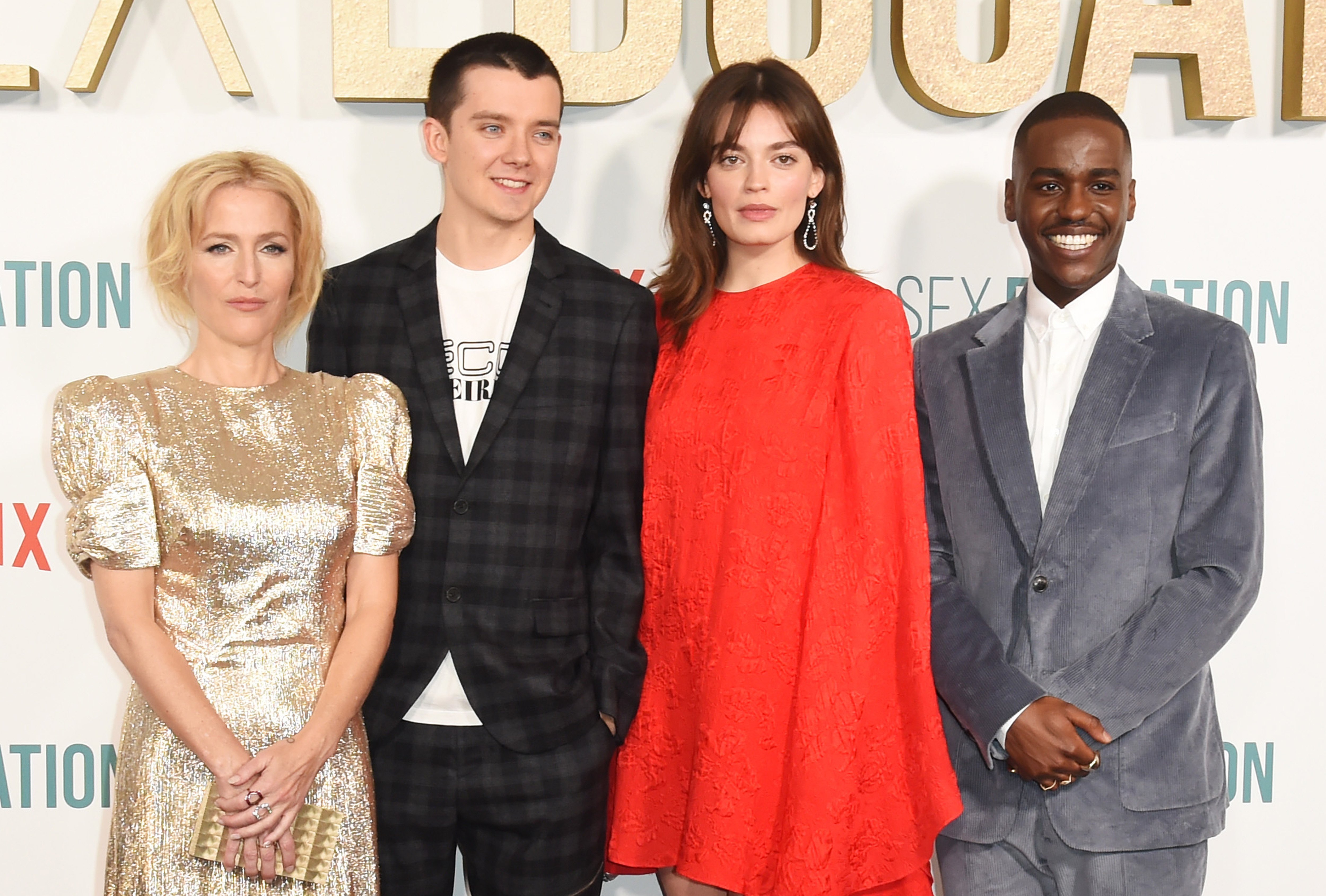 Gillian Anderson, Asa Butterfield, Emma Mackey and Ncuti Gatwa pose for photographers at the premiere of 'Sex Education' Season 2