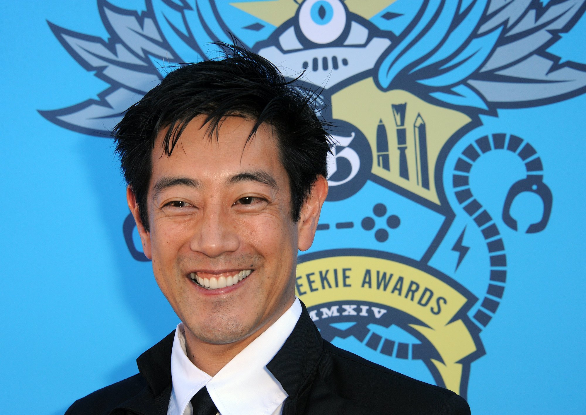 Grant Imahara poses for photographers as he arrives at the 2014 Geekie Awards