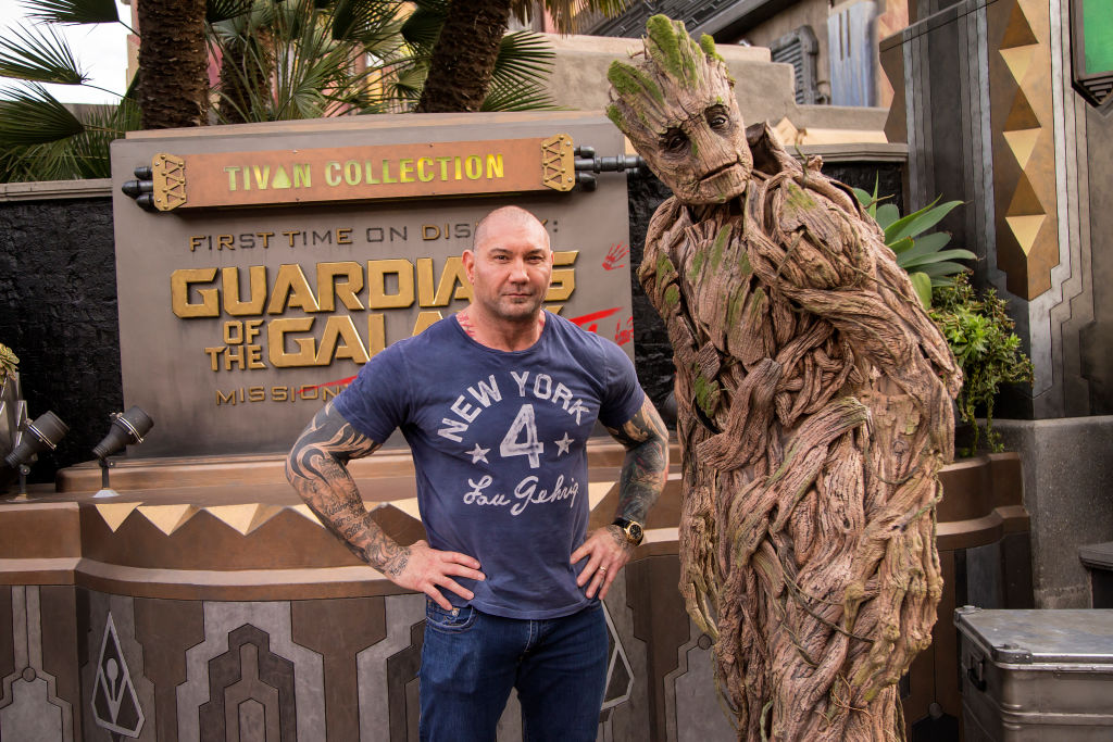 Actor Dave Bautista poses with Groot outside the Guardians of the Galaxy - Mission: BREAKOUT! attraction