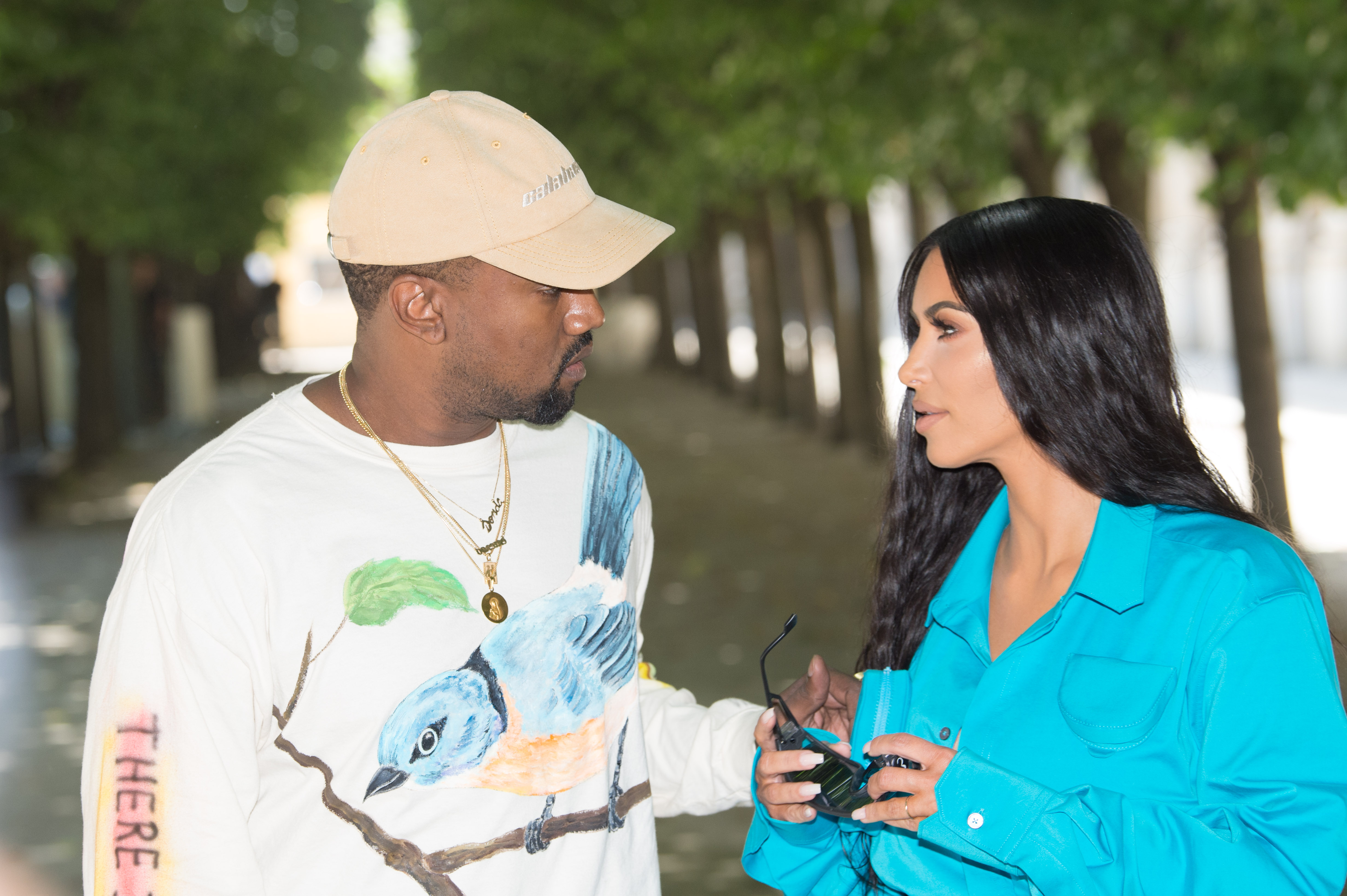 Kanye West and Kim Kardashian West at a fashion show