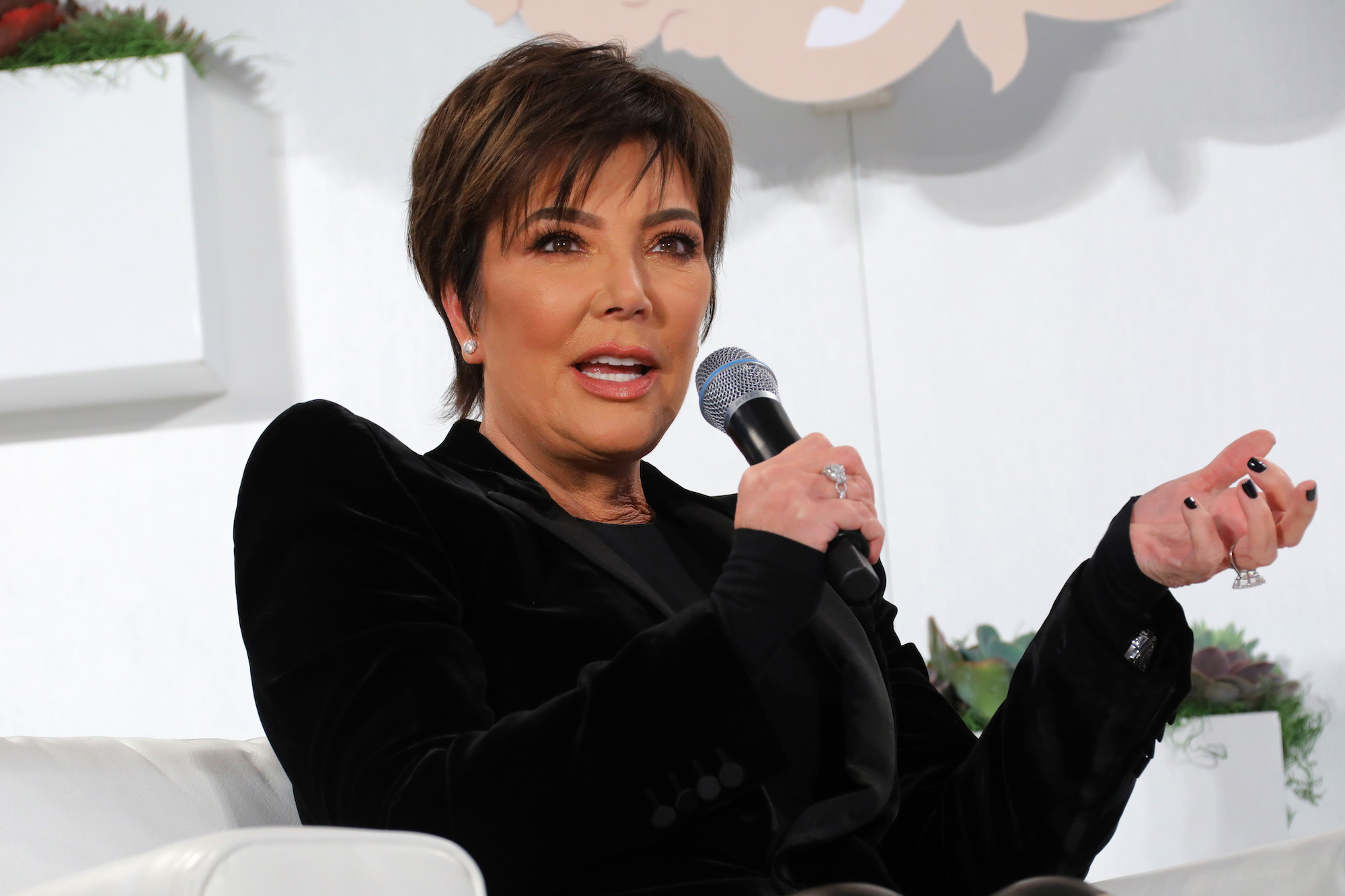 Kris Jenner talking into a microphone