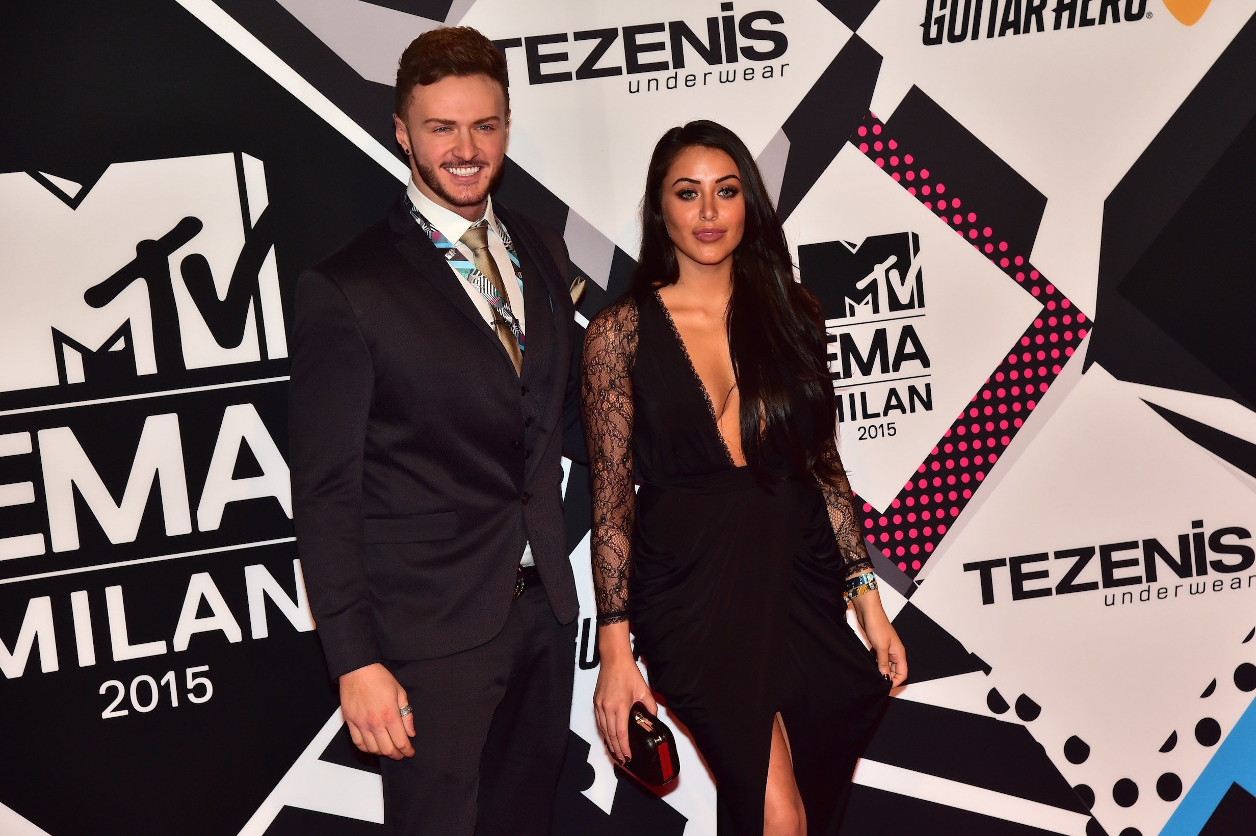 Kyle Christie (L) and Marnie Simpson pose on the red carpet of the 2015 MTV Europe Music Awards