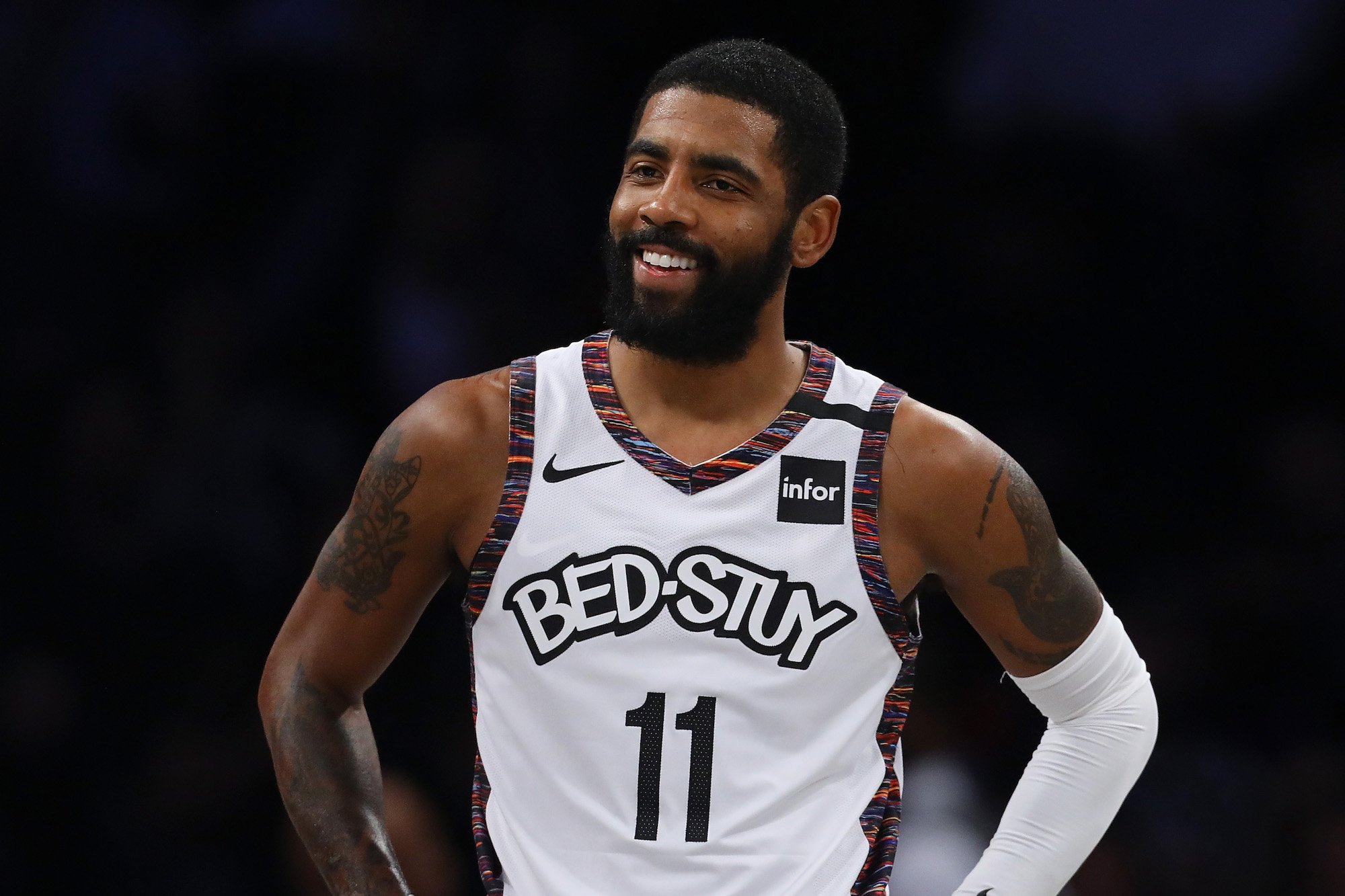 Kyrie Irving smiling on the court
