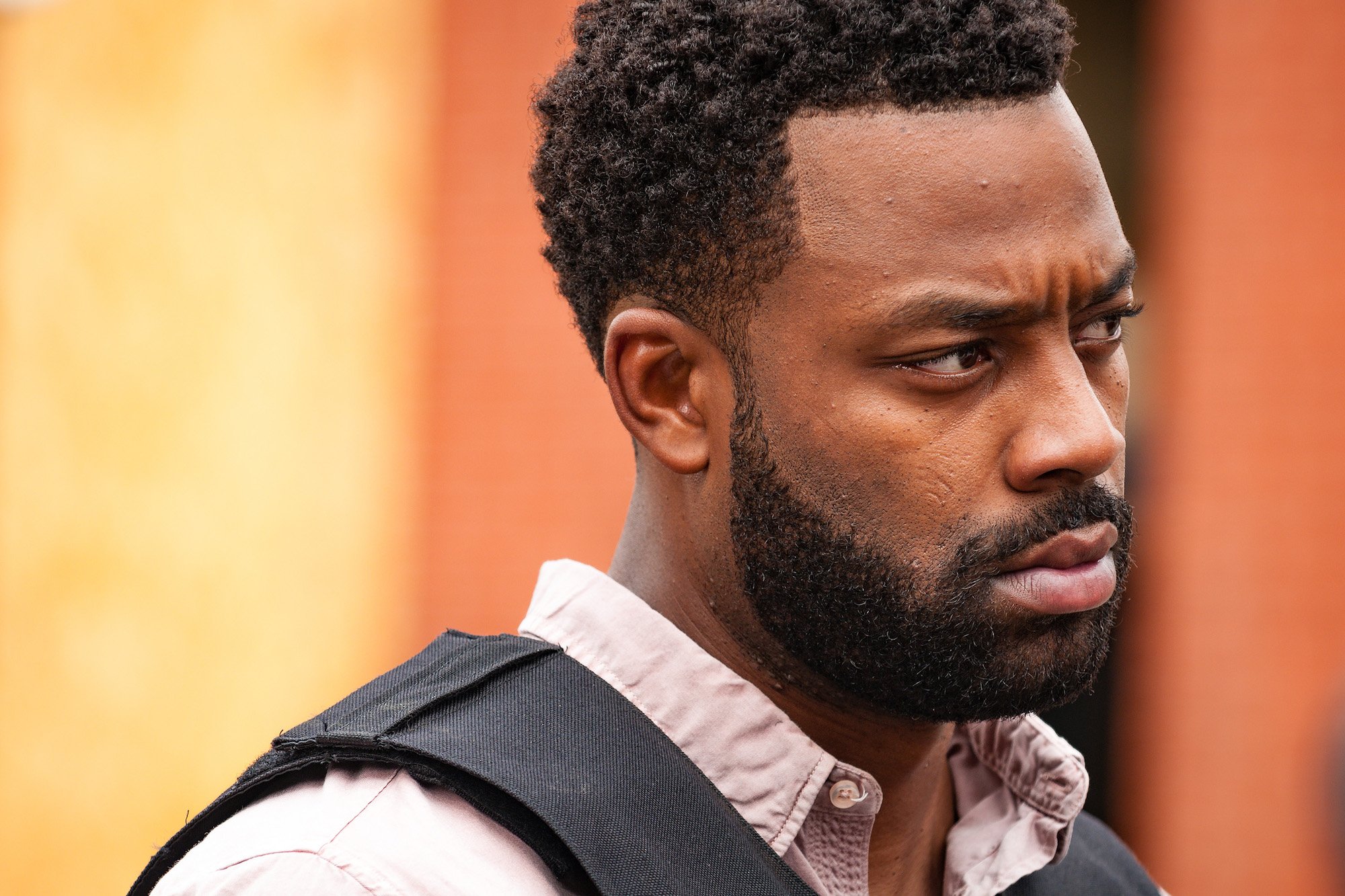 LaRoyce Hawkins as Officer Kevin Atwater looking away from the camera