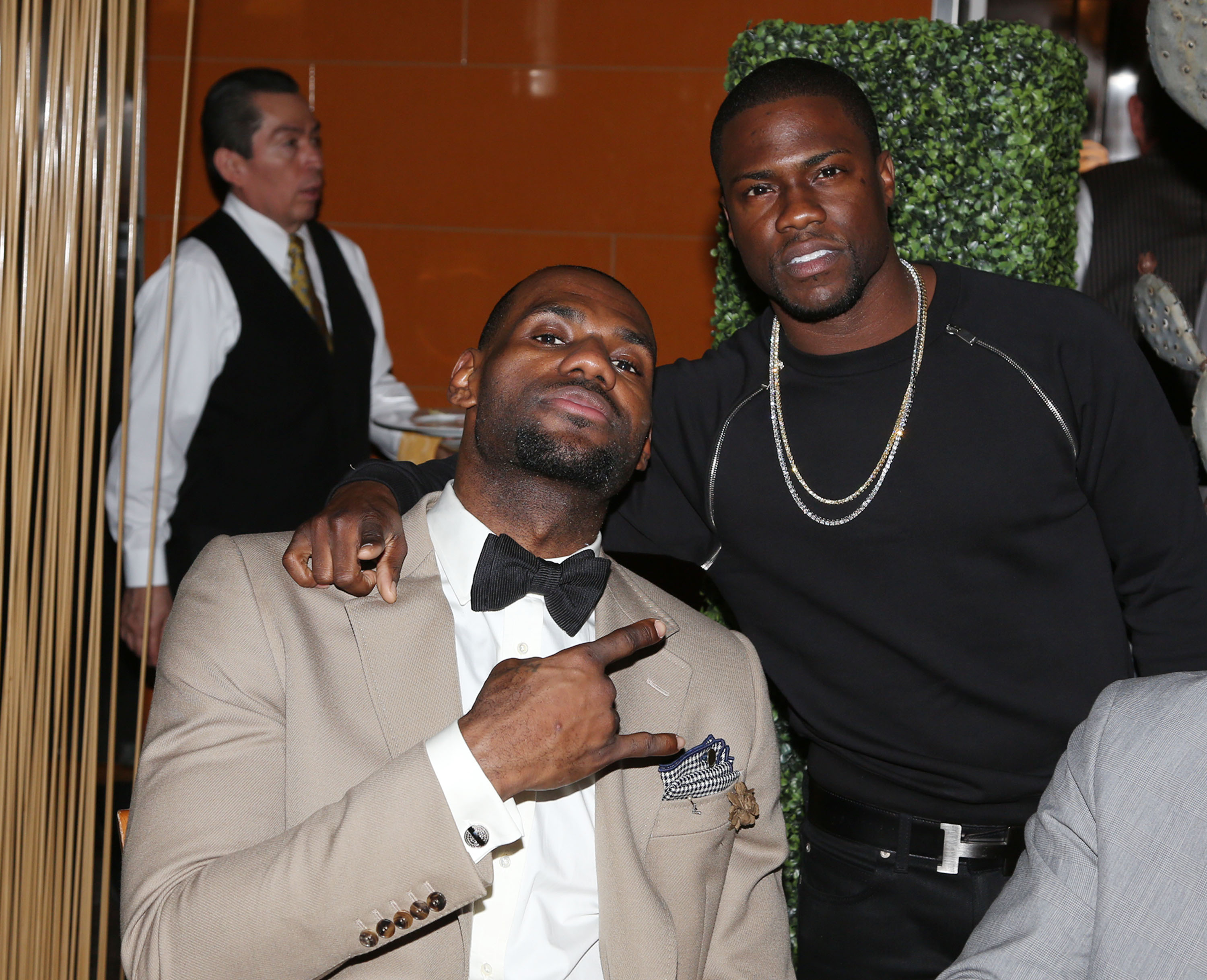 LeBron James and Kevin Hart taking a picture together at an event