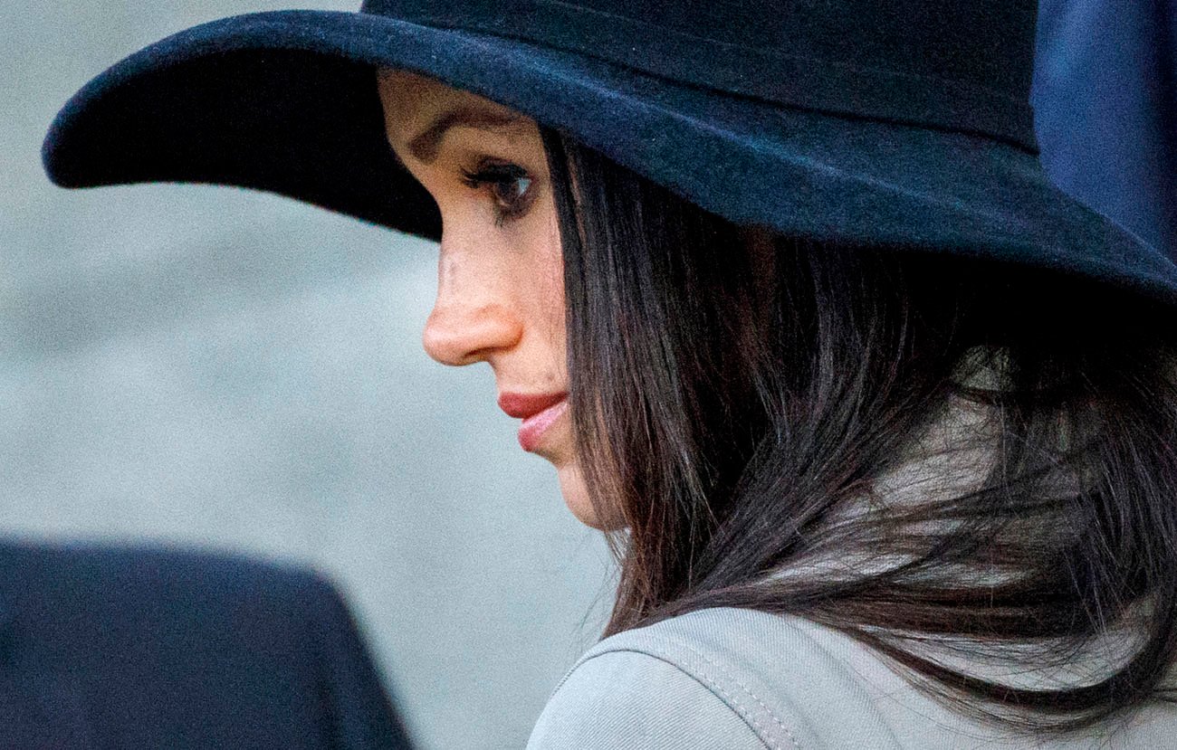 Meghan Markle wearing a blue hat, close up