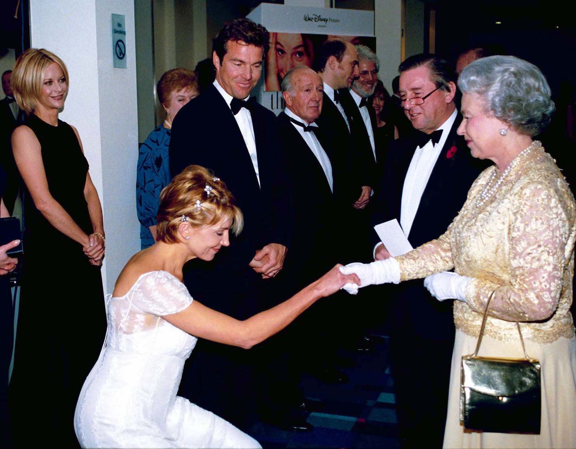 Natasha Richardson curtseying to Queen Elizabeth II at 'The Parent Trap' Premiere