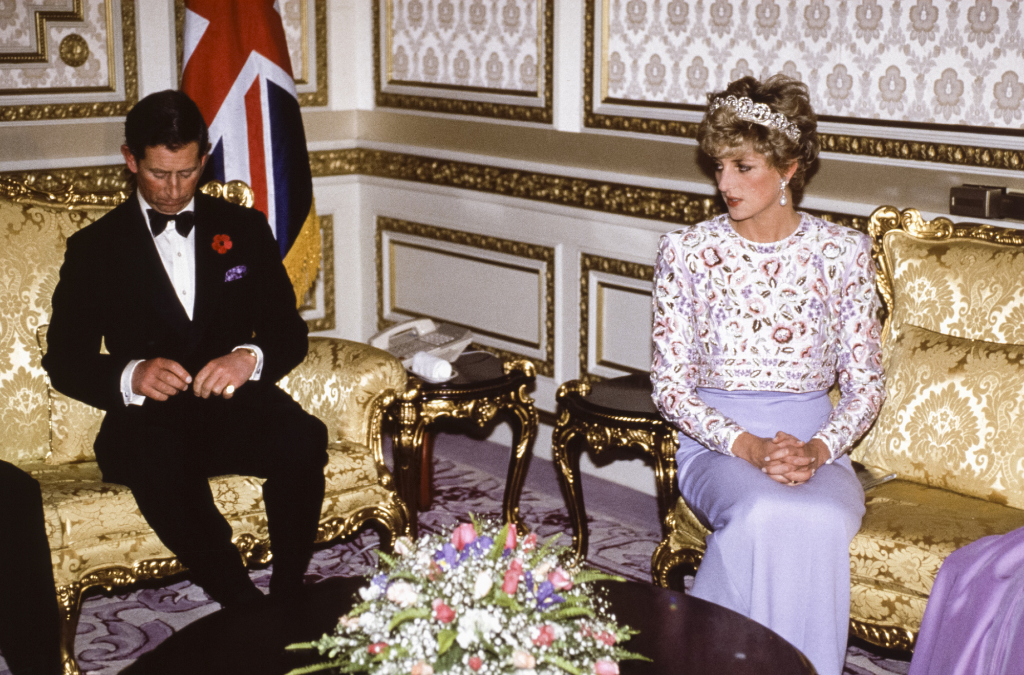 Princess Diana and Prince Charles sit apart from each other in South Korea