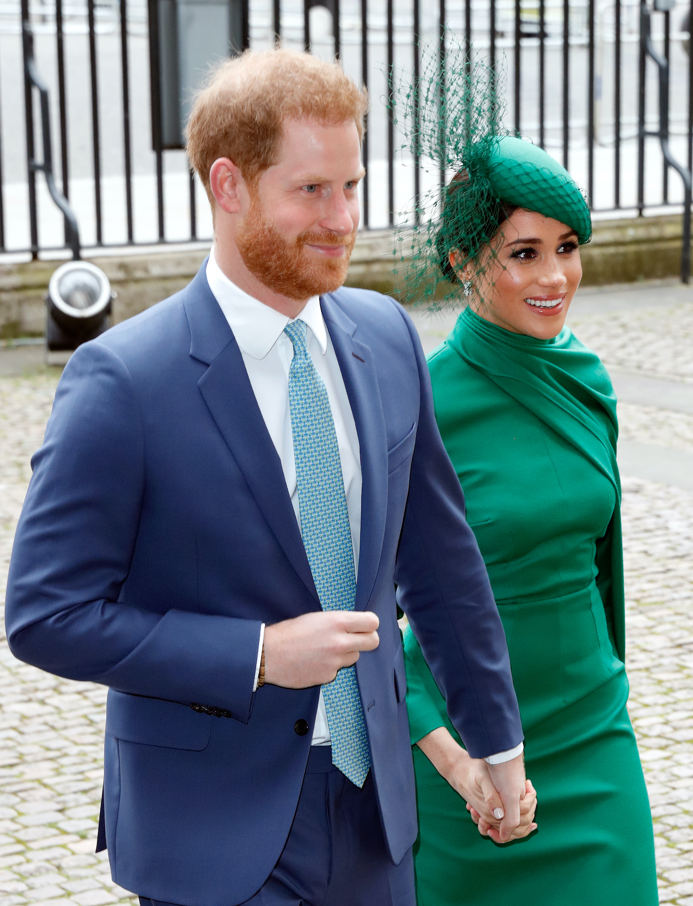 Prince Harry and Meghan Markle hold hands as they arrive at the 2020 Commonwealth Day Service
