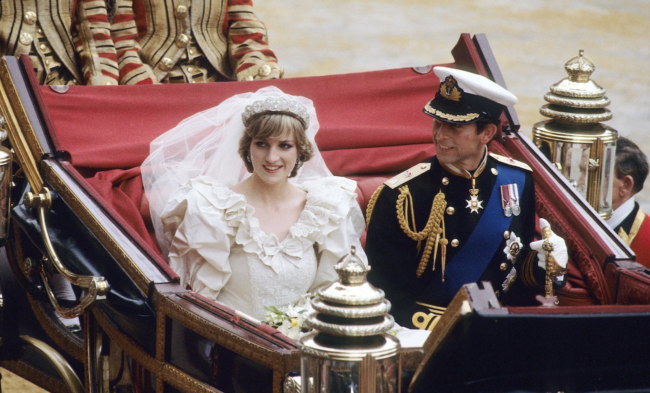Princess Diana and Prince Charles ride in a carriage at their royal wedding