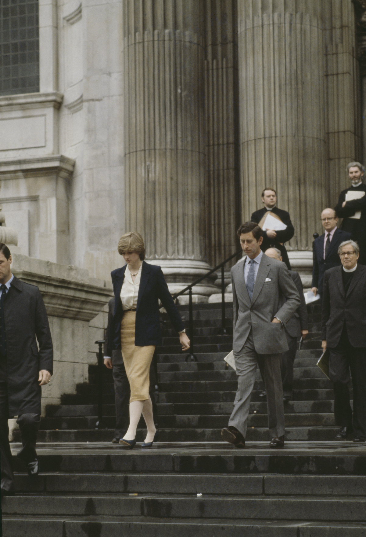 Princess Diana and Prince Charles walk down the steps of St. Paul's Cathedral after their first wedding rehearsal