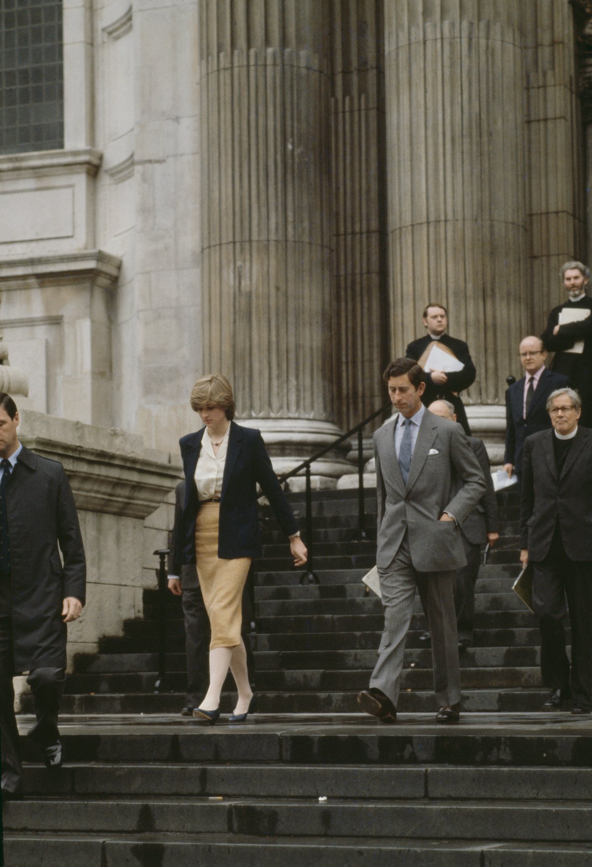 Princess Diana and Prince Charles walk down the steps of St. Paul's Cathedral after their first wedding rehearsal