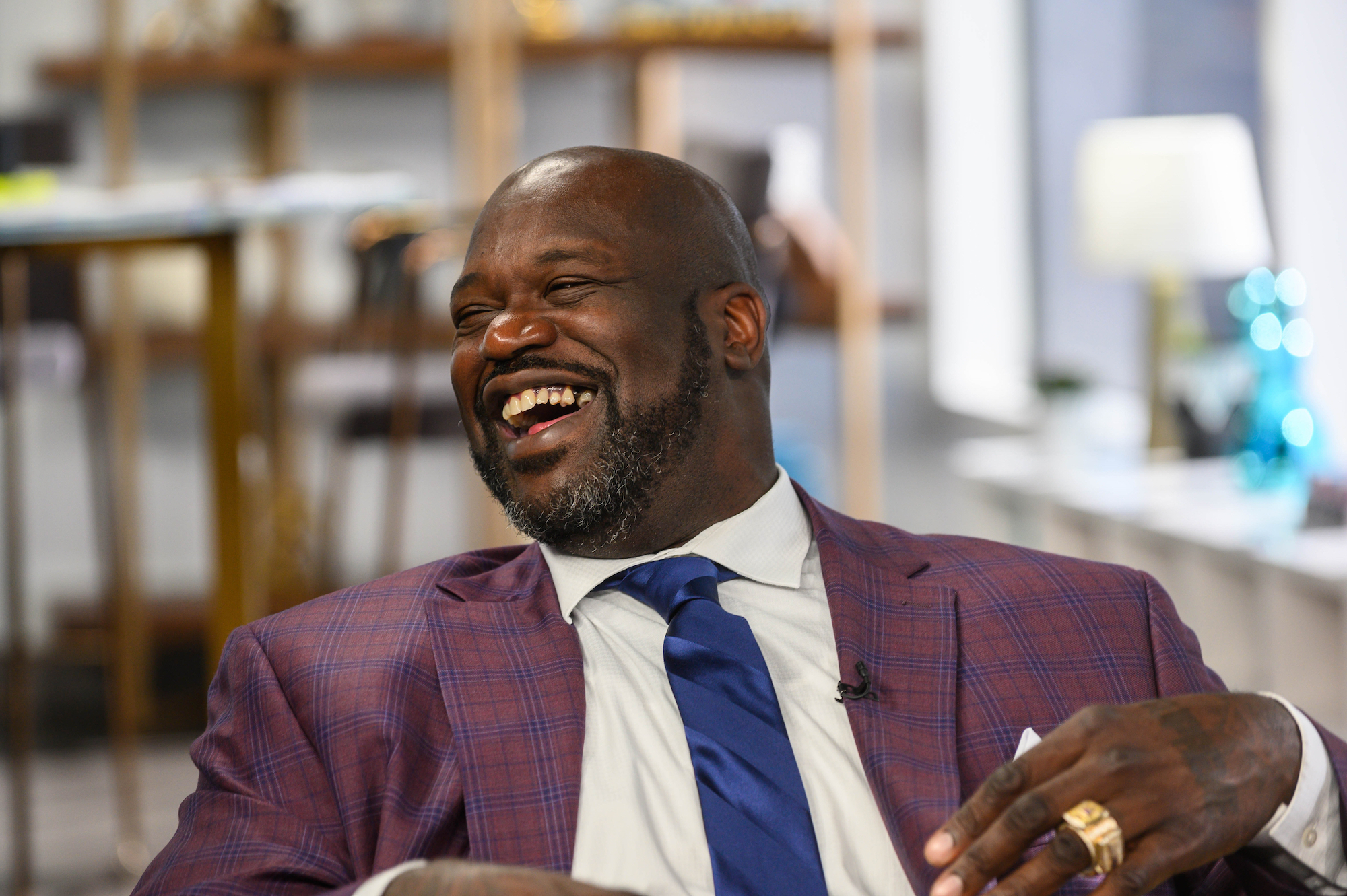 Shaquille O'Neal laughing, turned to the side
