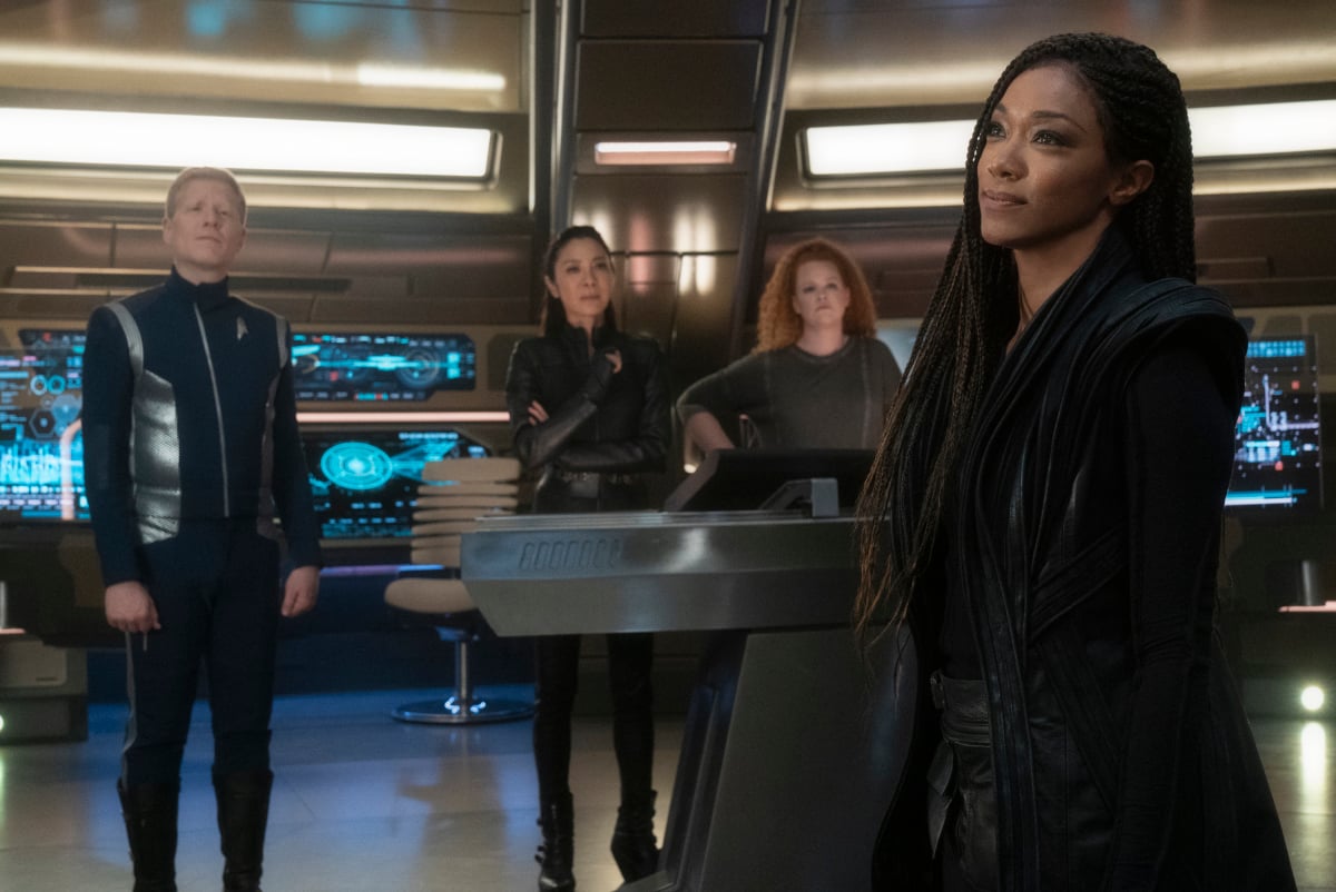 Star Trek: Discovery cast stands on main deck of the USS Discovery ship