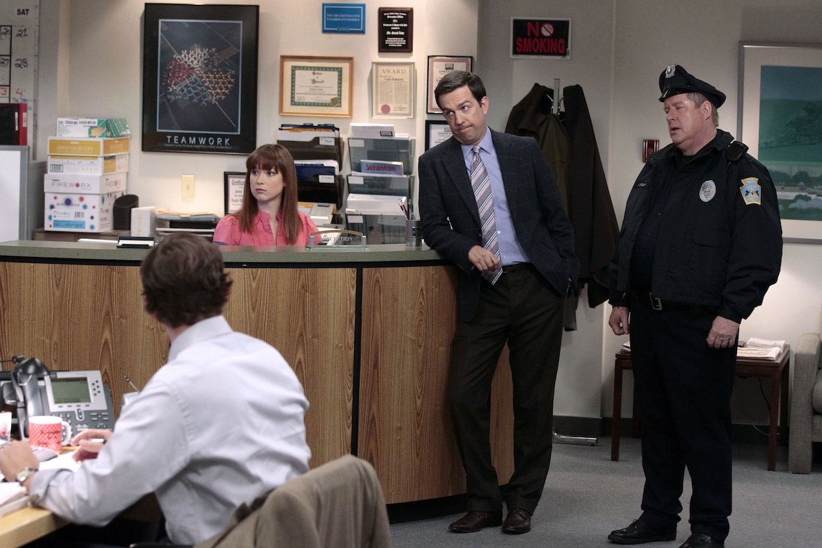 John Krasinski as Jim Halpert, Ellie Kemper as Kelly Erin Hannon, Ed Helms as Andy Bernard, Michael "Tuba" Heatherton as policeman on 'The Office'