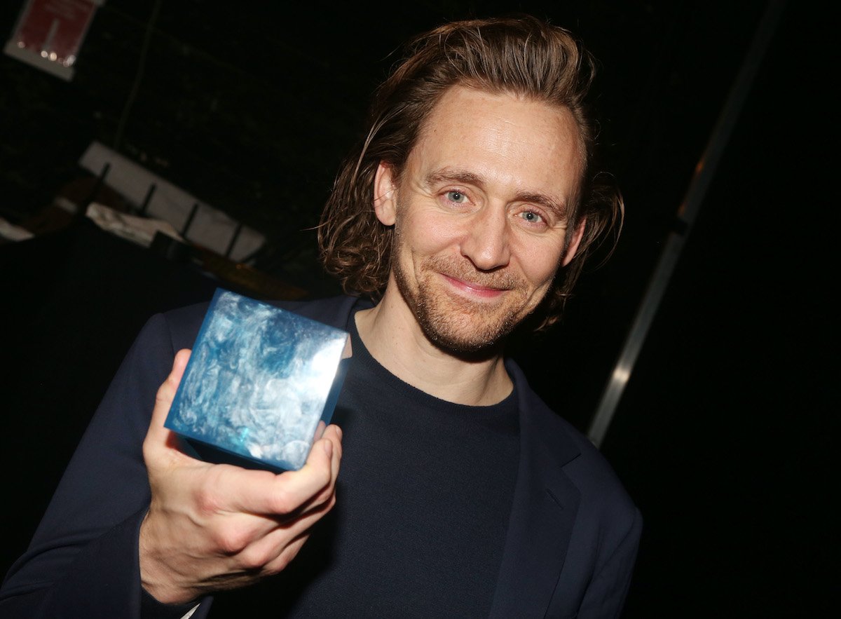 Tom Hiddleston poses with the "Tesseract Blue Infinity Stone"