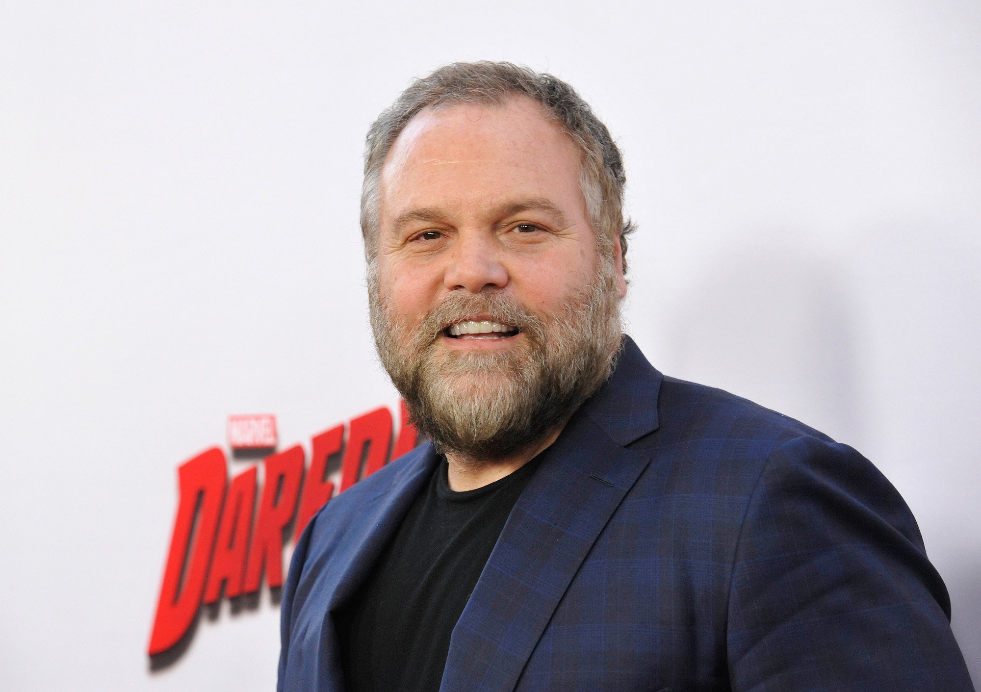 Vincent D'Onofrio smiling in front of a white background