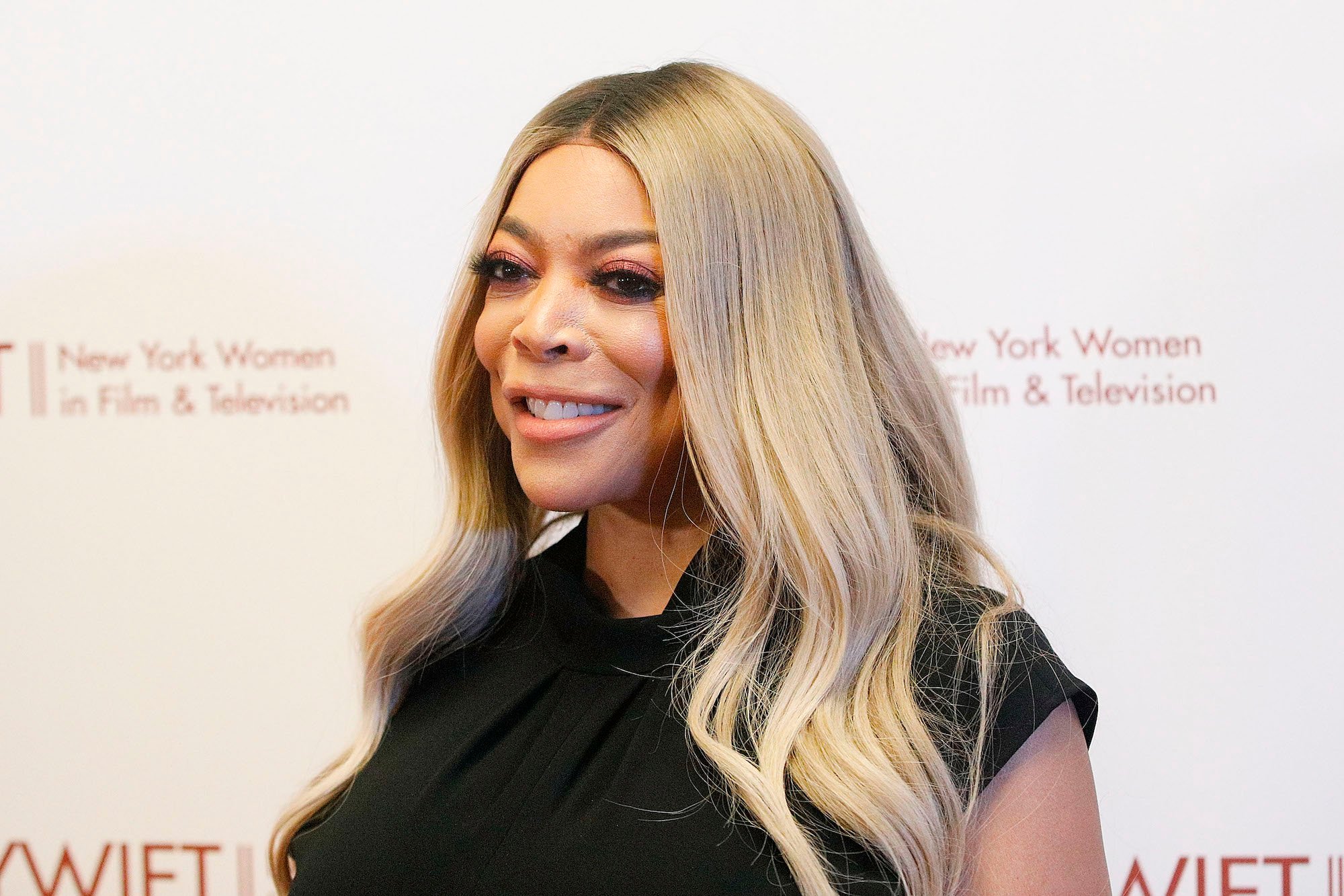 Wendy Williams smiling, turned to the left