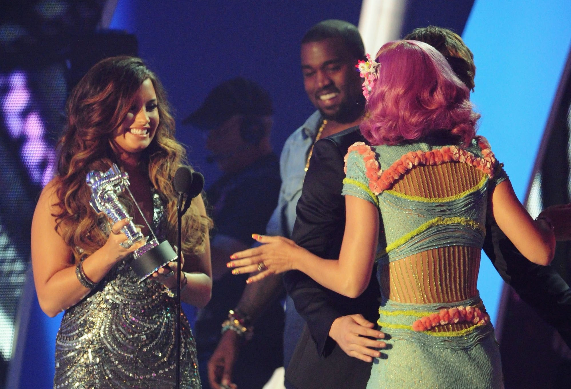Singers Kanye West, Demi Lovato and Katy Perry speak onstage during the 2011 MTV Video Music Awards at Nokia Theatre L.A. Live on August 28, 2011 in Los Angeles, California.