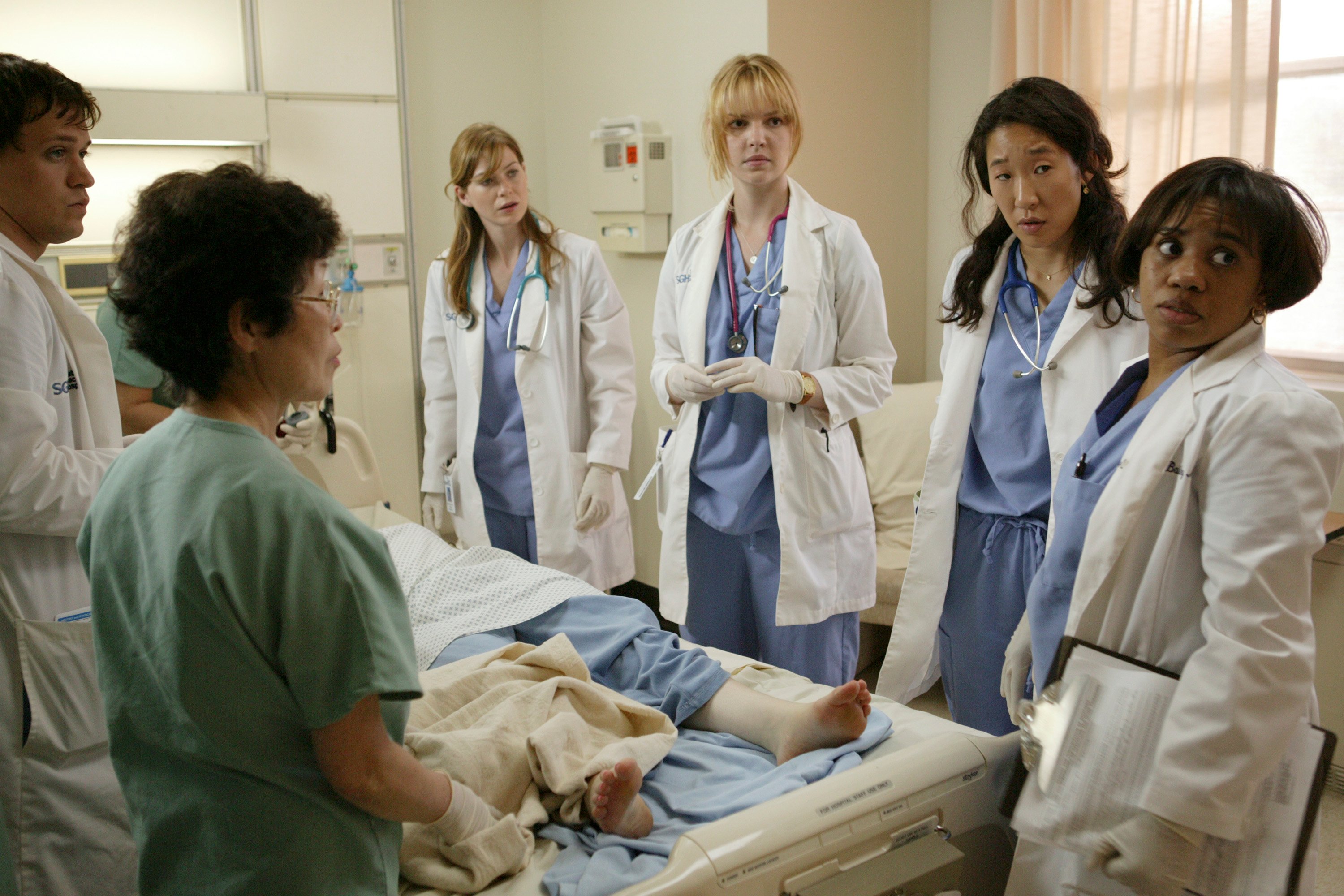 Ellen Pompeo as Meredith Grey, Katherine Heigl as Izzie Stevens, Sandra Oh as Cristina Yang, and Chandra Wilson as Miranda Bailey in the 'Grey's Anatomy' pilot