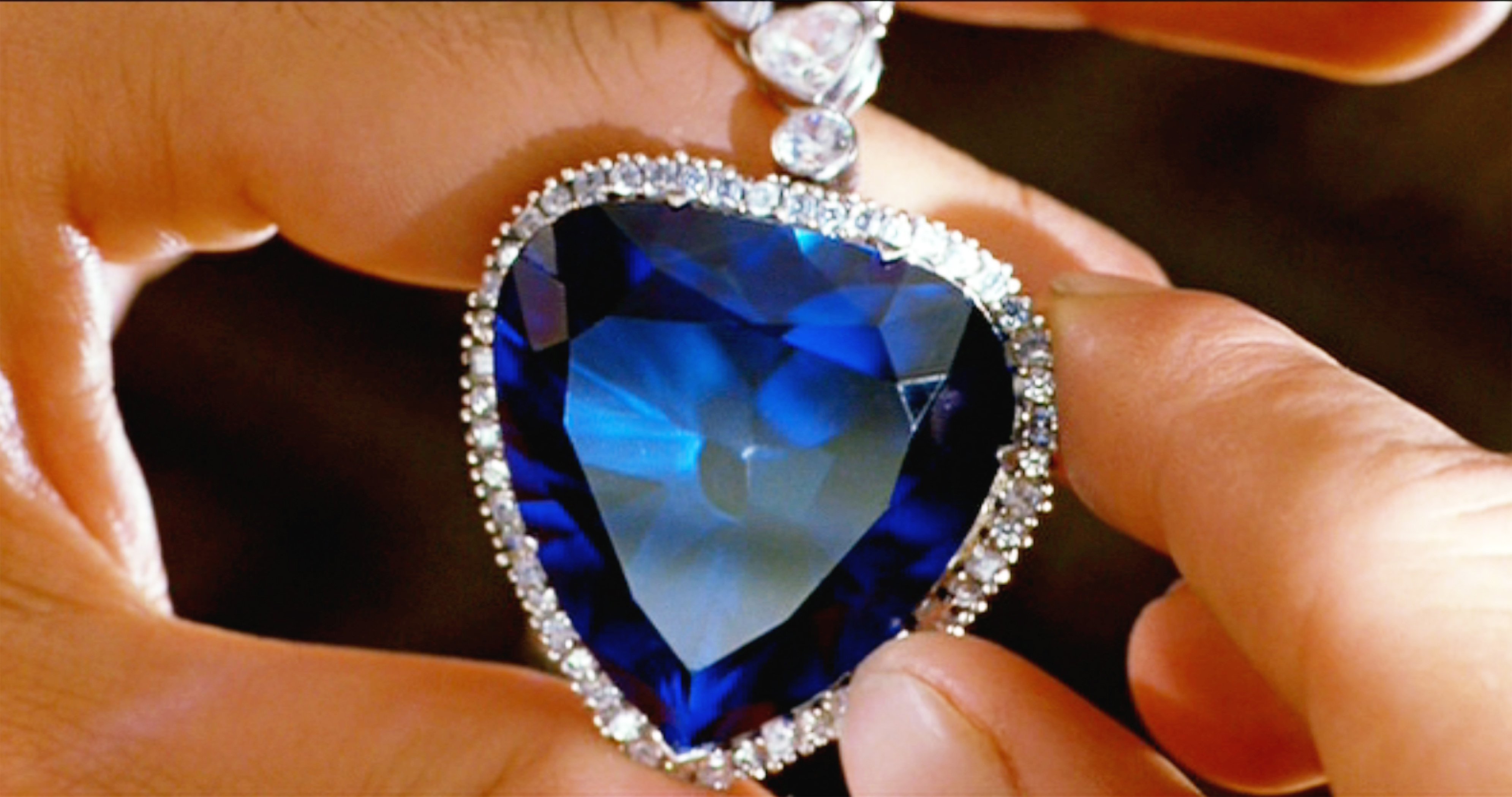 Someone holding the Heart of the Ocean diamond