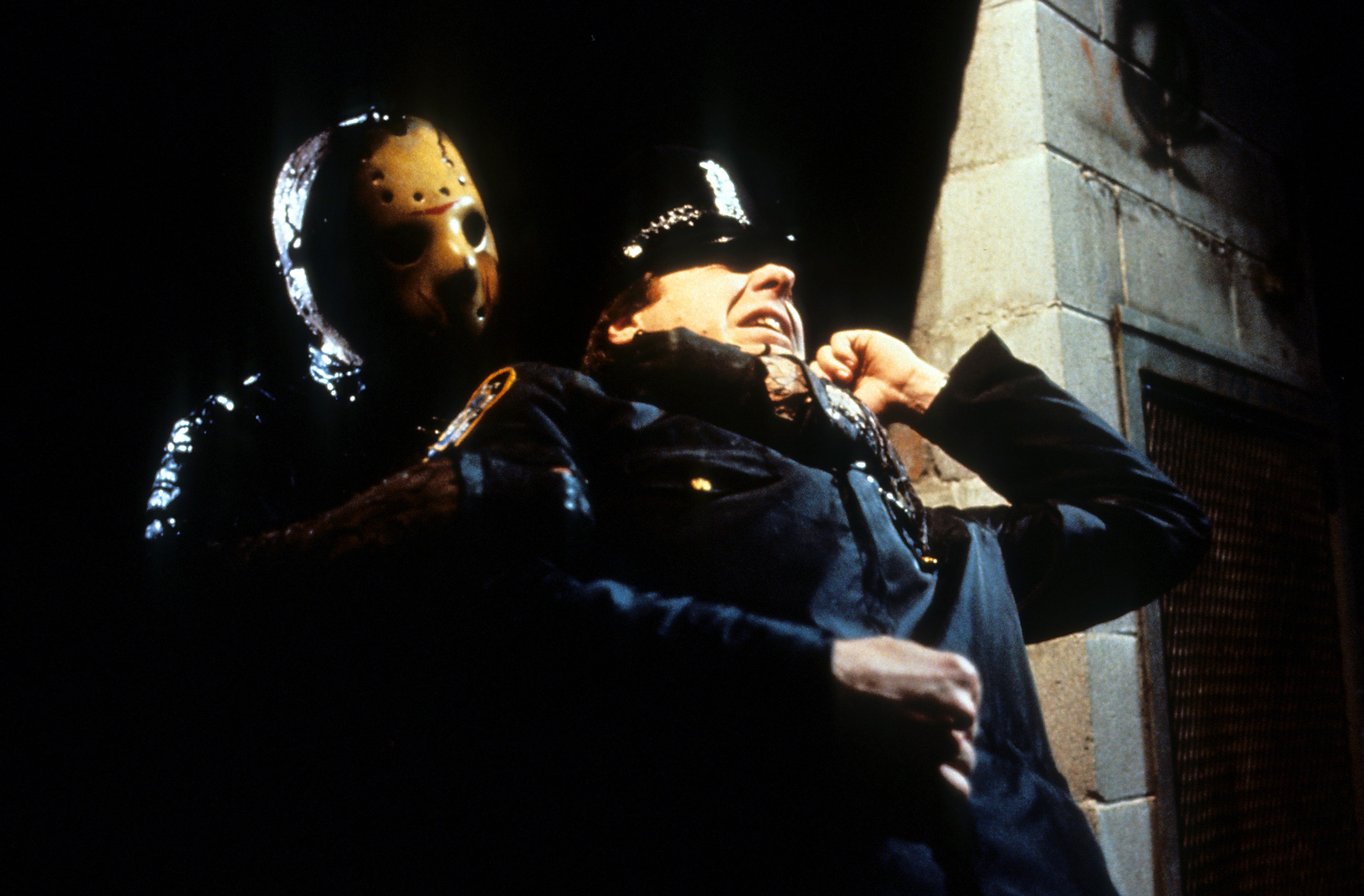 Jason Vorhees from the Friday the 13th films with a cop