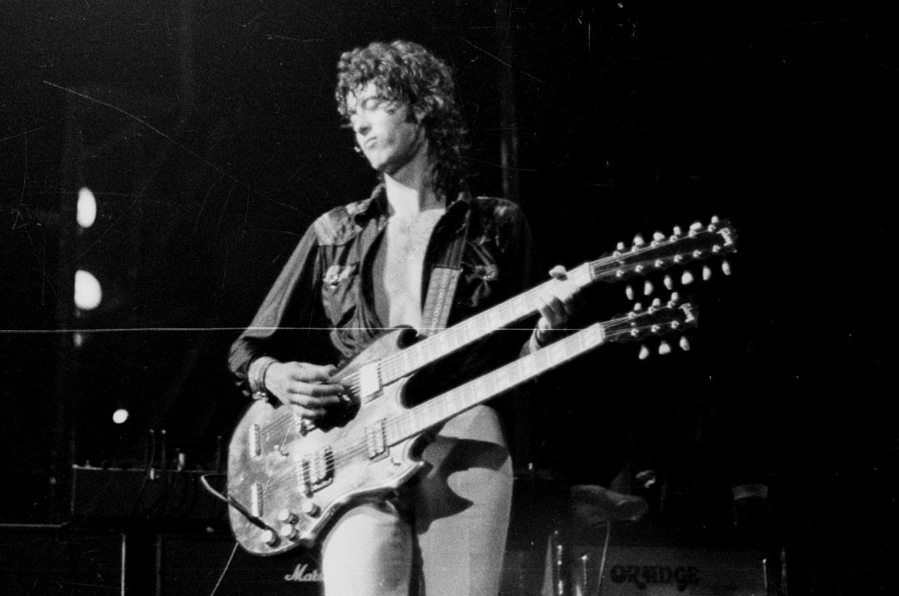 Jimmy Page playing a double-neck guitar on stage