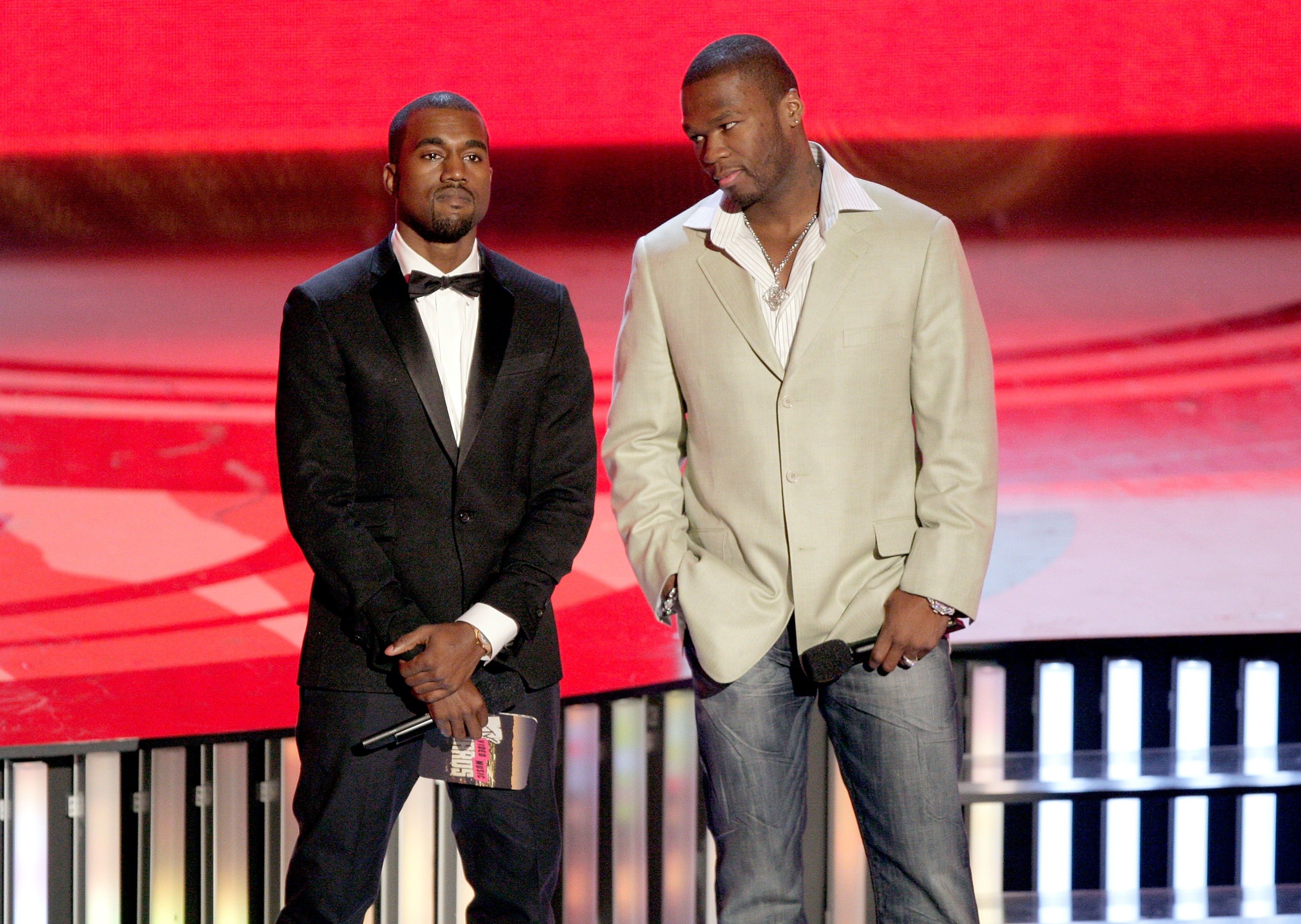 Kanye West standing next to 50 Cent