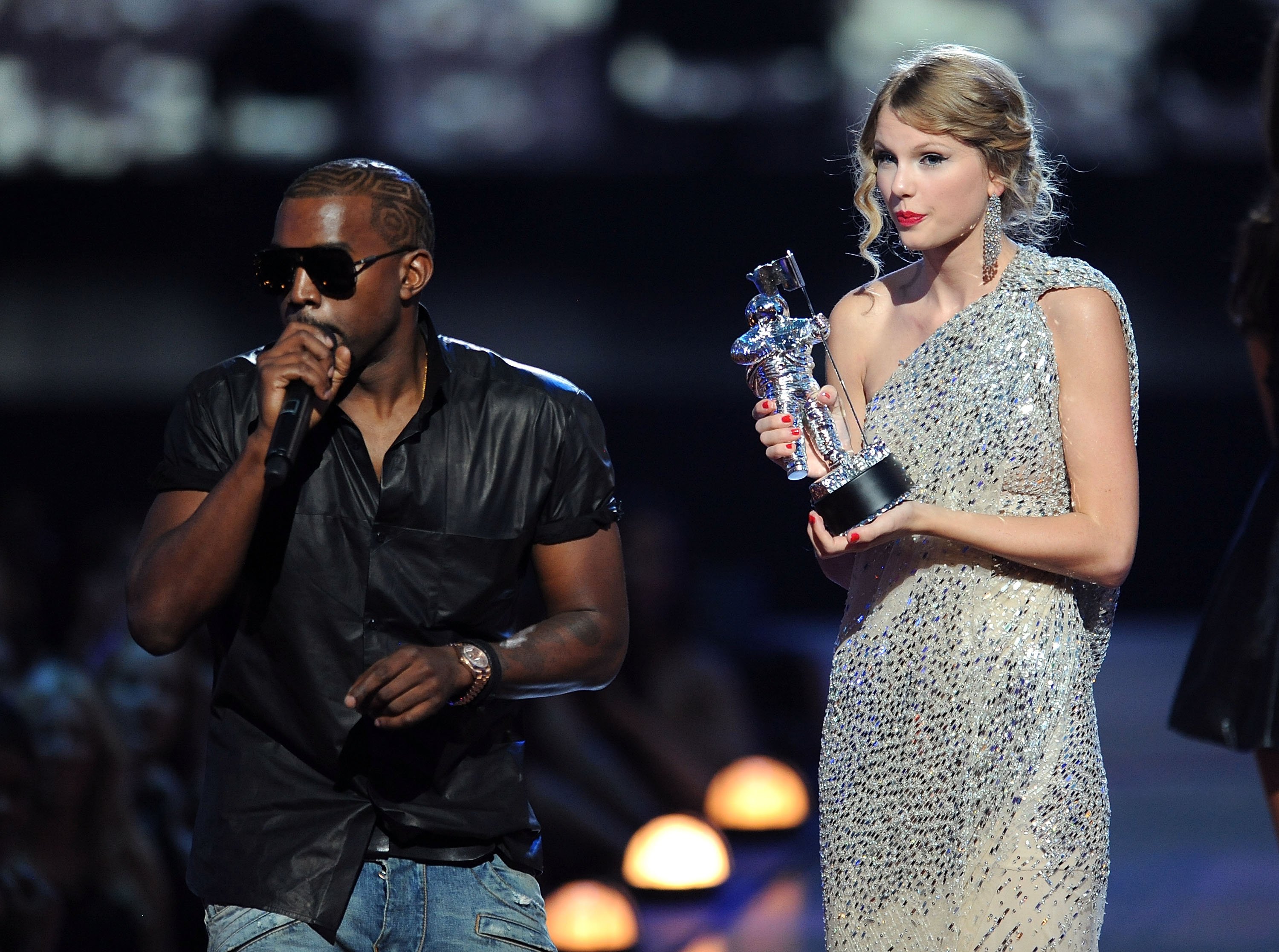 Kanye West takes the microphone from Taylor Swift during the 2009 MTV Video Music Awards on September 13, 2009 in New York City.