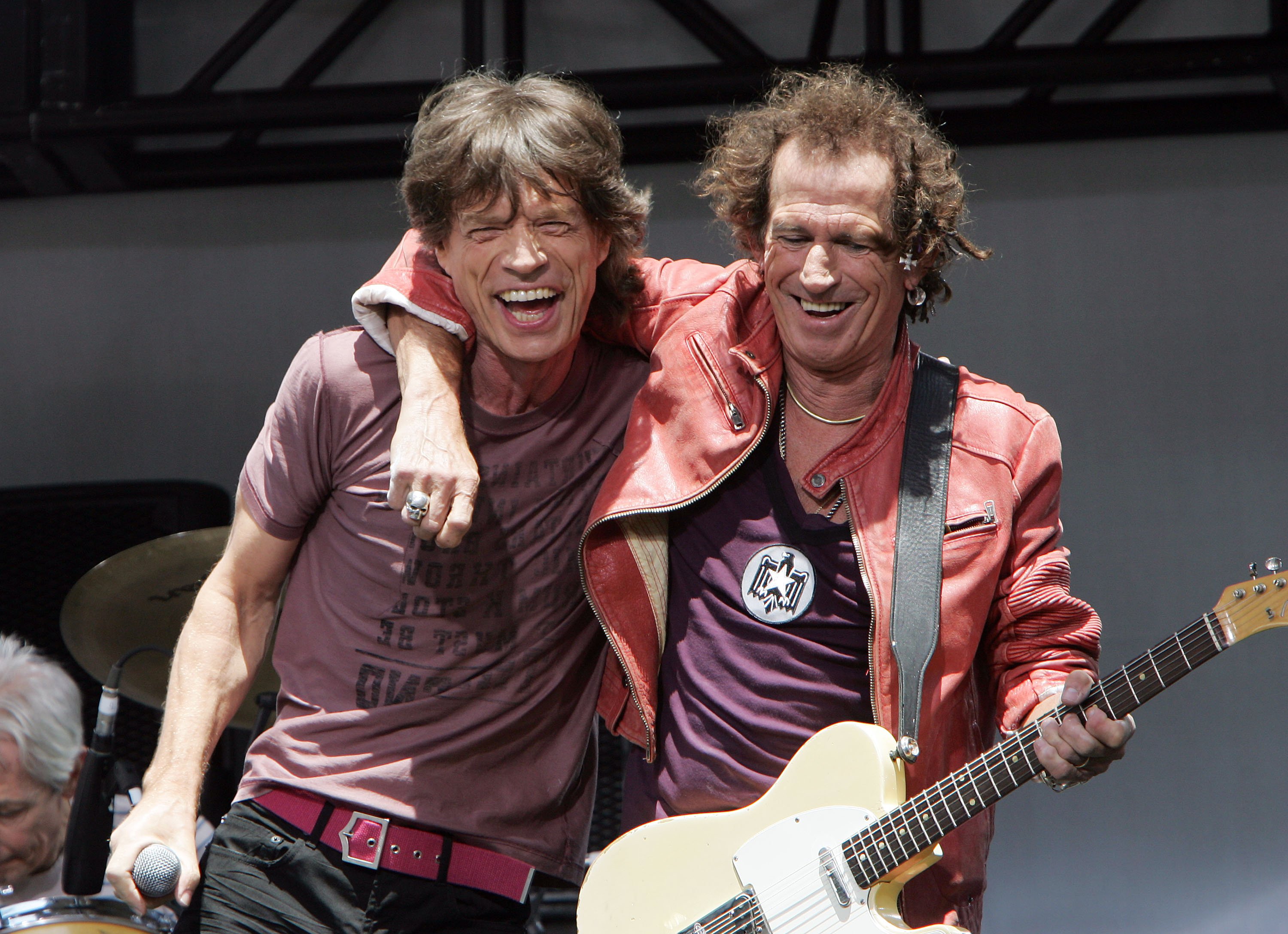 Mick Jagger next to Keith Richards holding his guitar