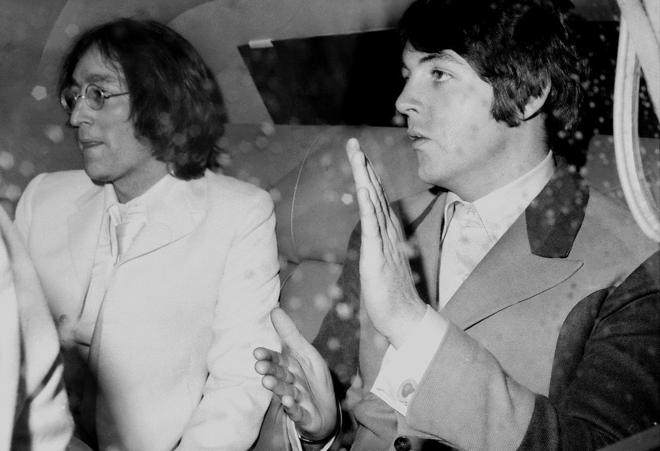 Lennon and McCartney in a limo at JFK airport