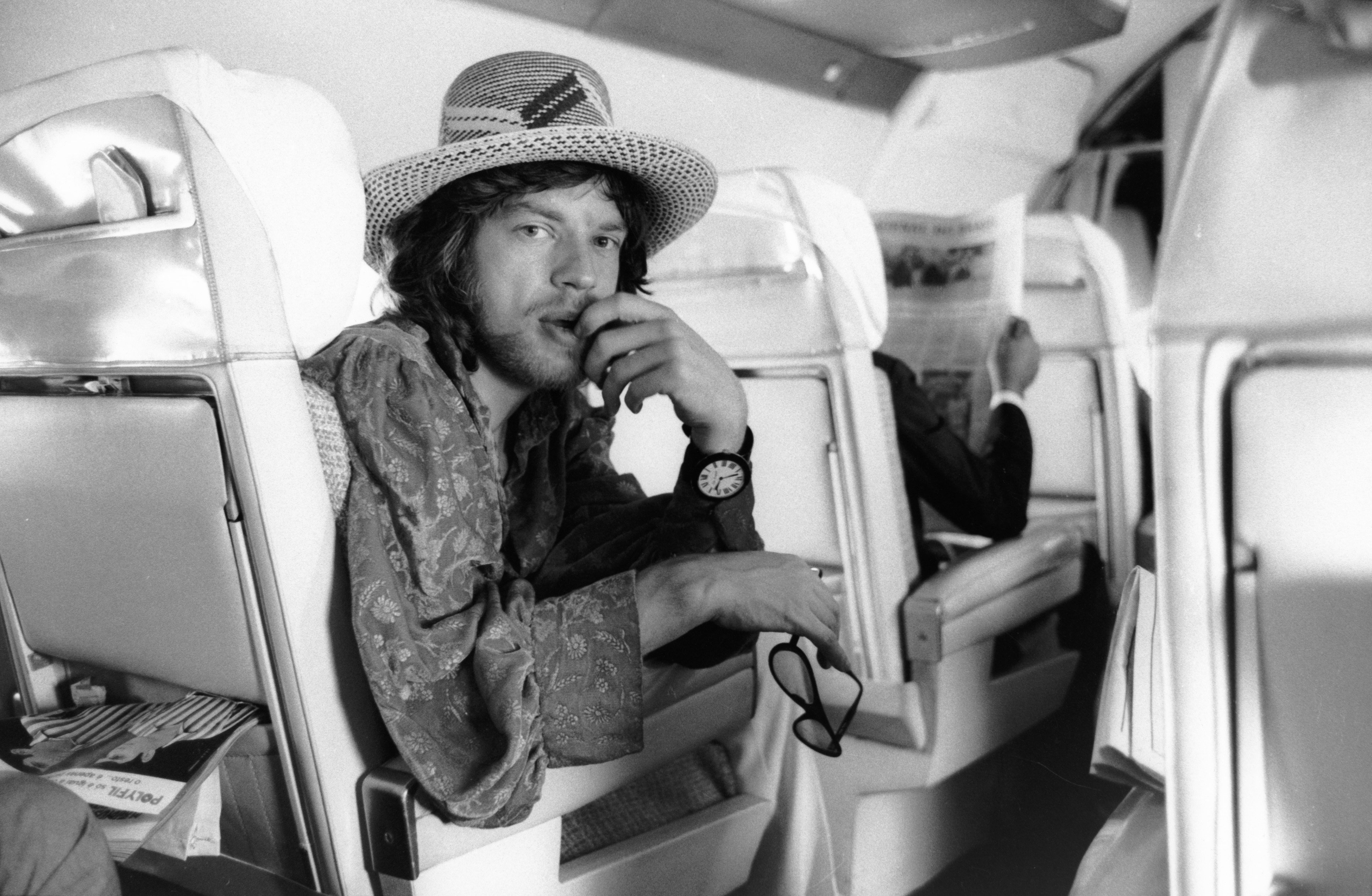 Mick Jagger sitting in a plane
