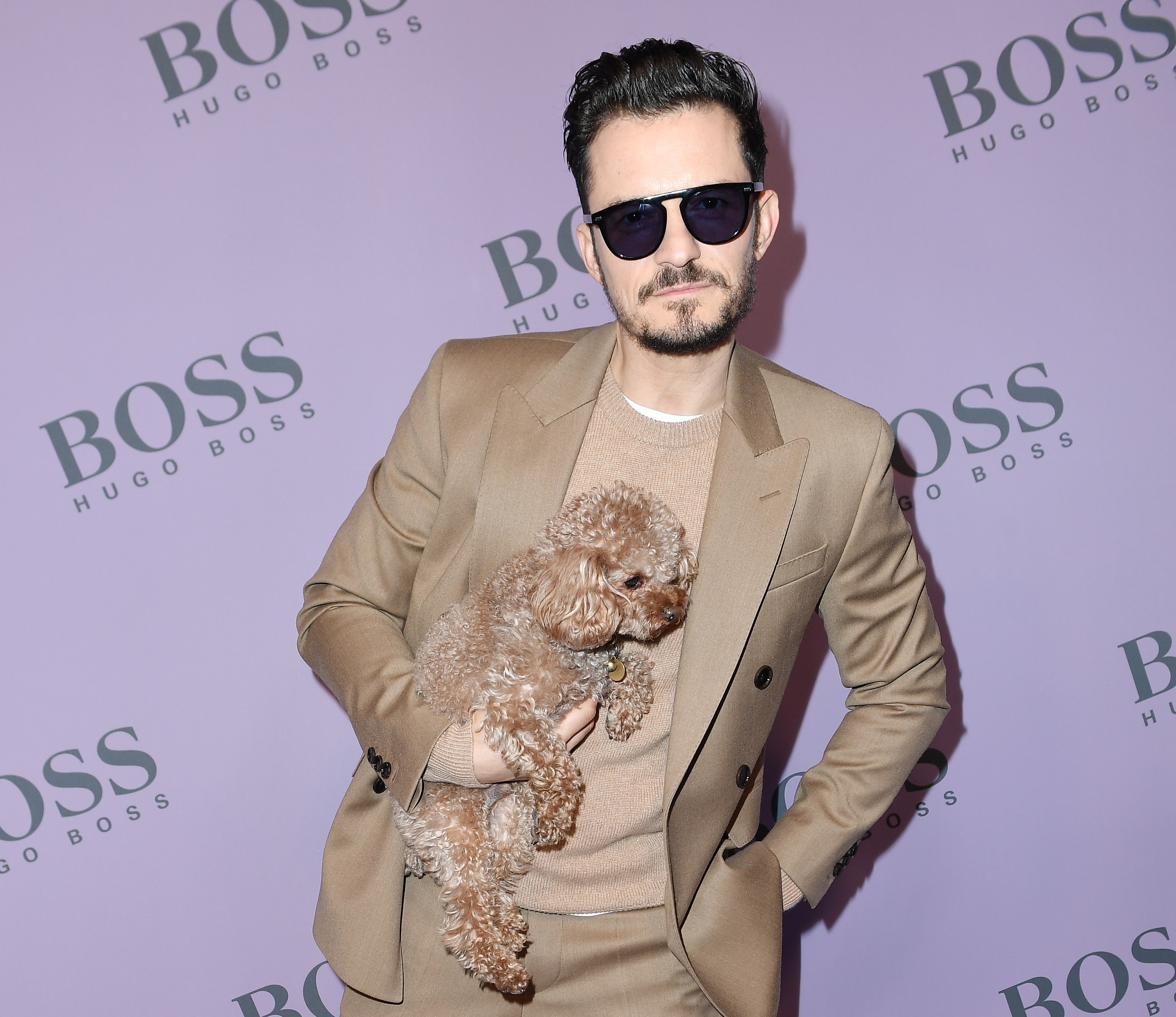 Orlando Bloom with his dog Mighty attend the Boss fashion show on February 23, 2020 in Milan, Italy.