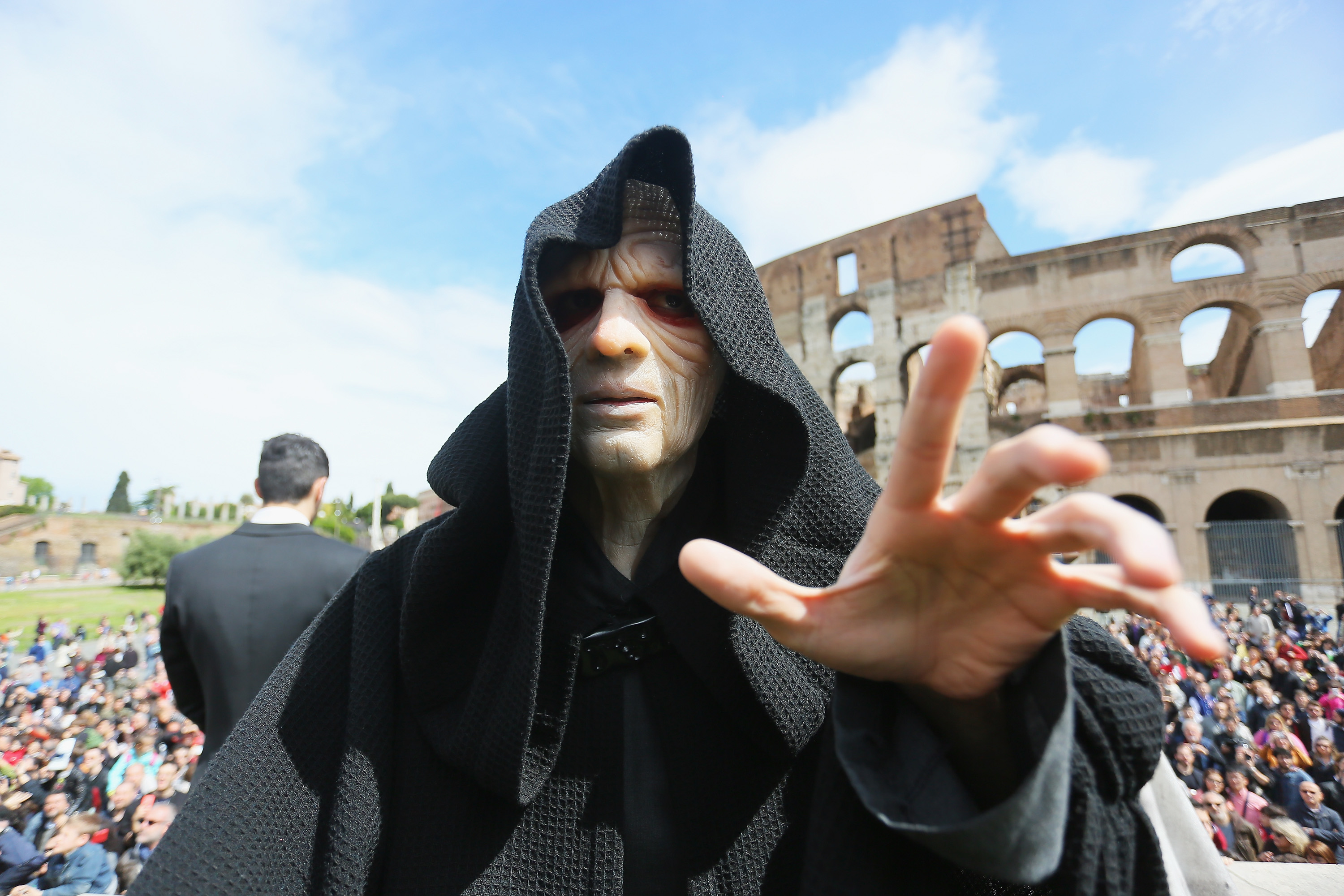 An Emperor Palpatine cosplayer by the Colosseum