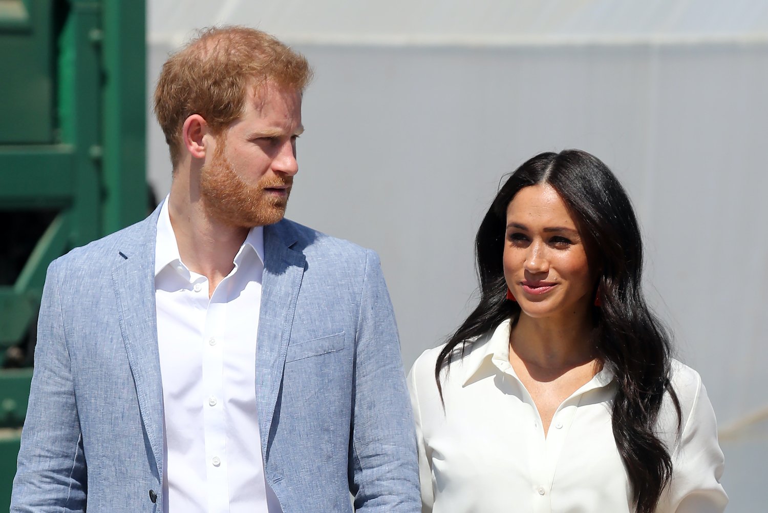 Prince Harry and Meghan Markle standing next to each other