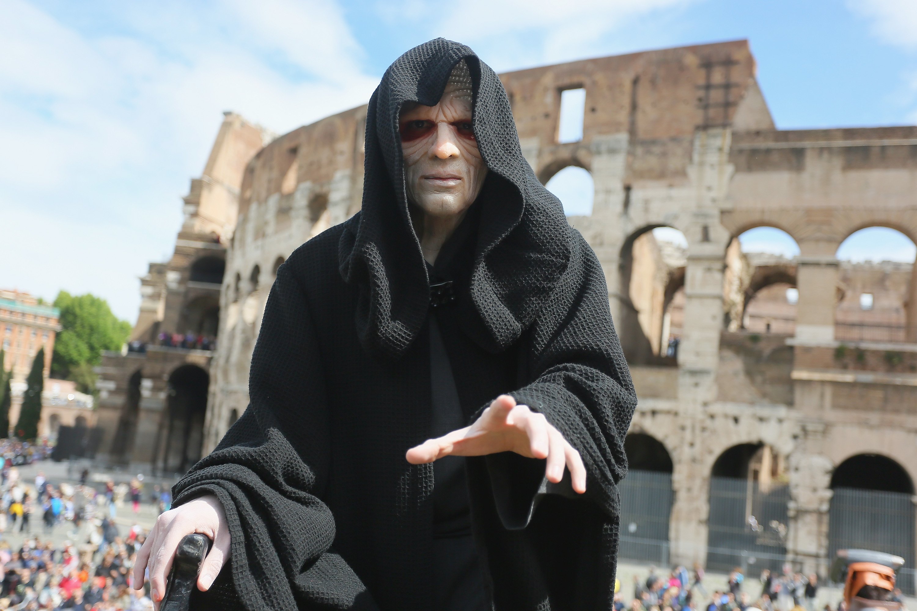 An Emperor Palpatine cosplayer by the Colosseum