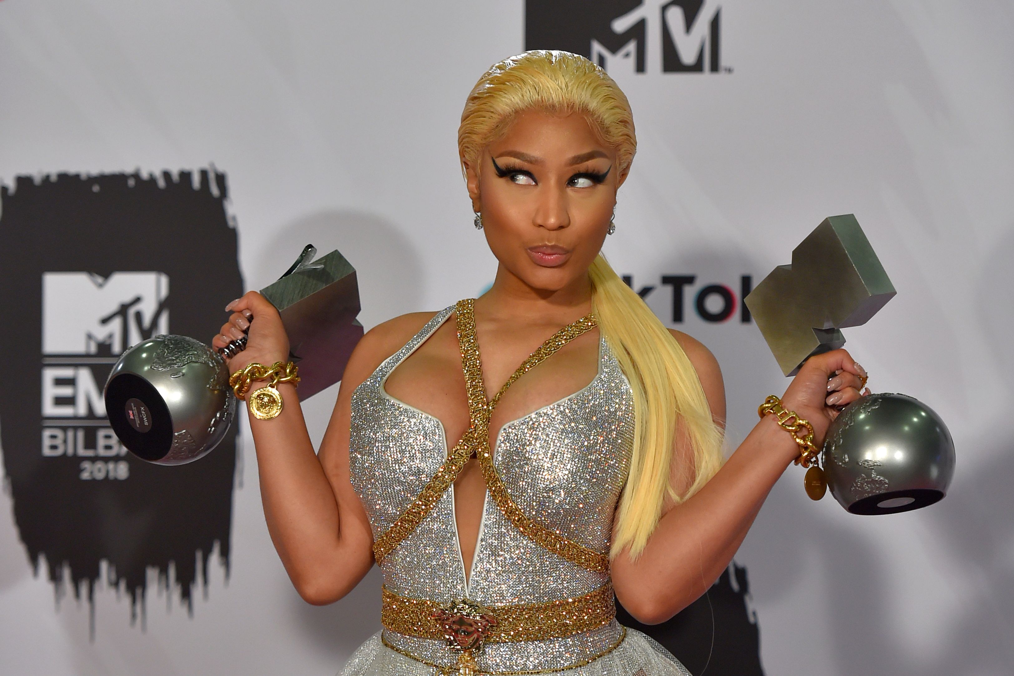 Nicki Minaj holding awards