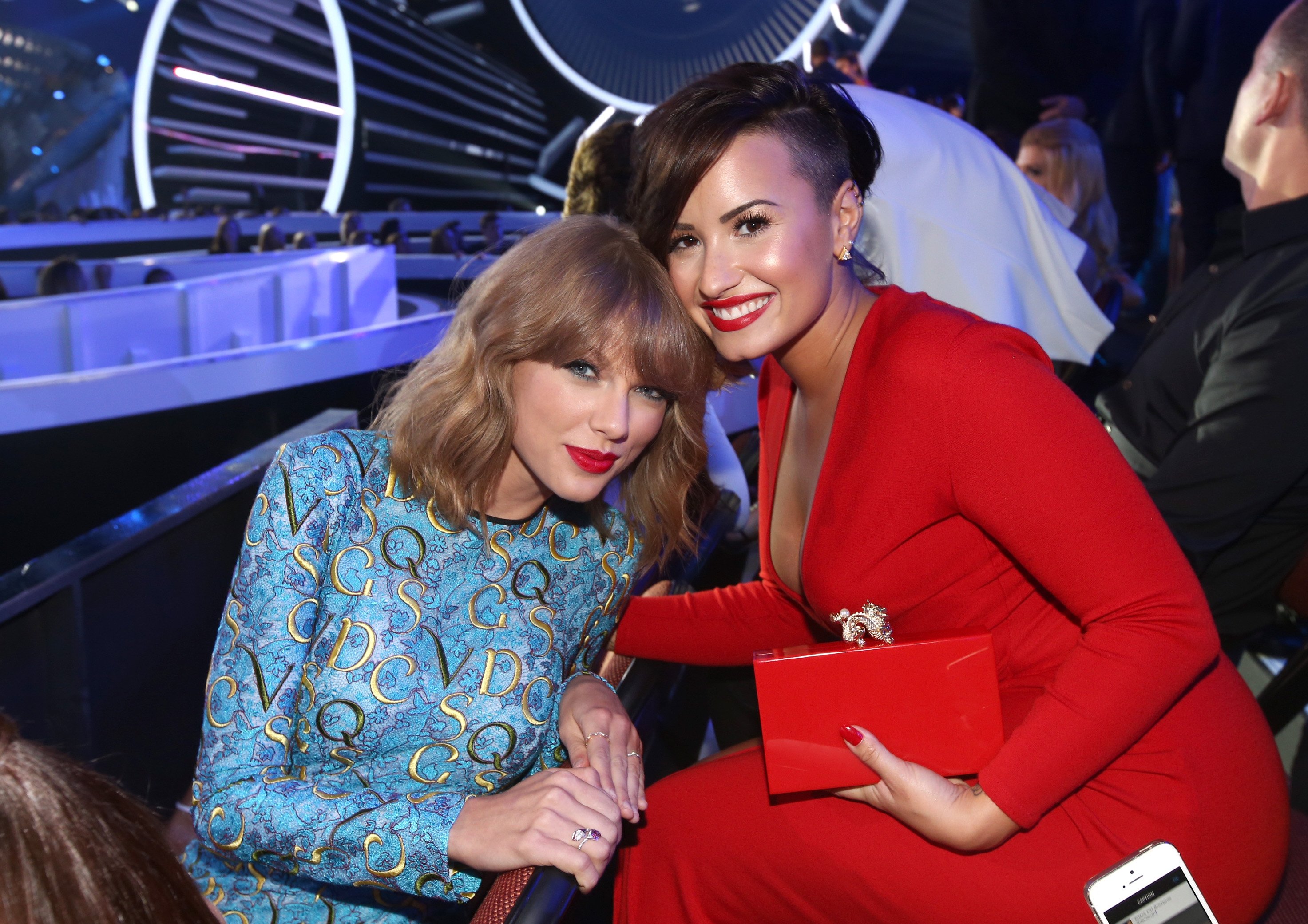 Taylor Swift (L) and Demi Lovato attend the 2014 MTV Video Music Awards on August 24, 2014