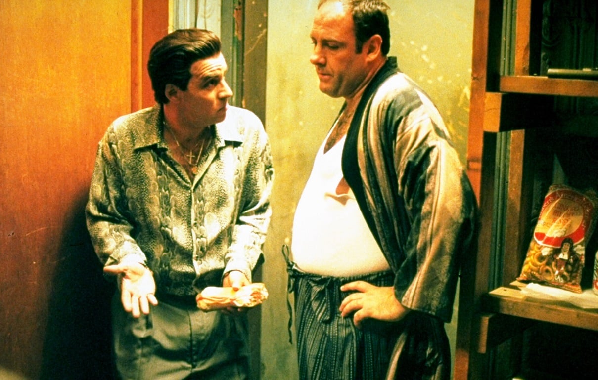 Steve Van Zandt and James Gandolfini speak in a basement