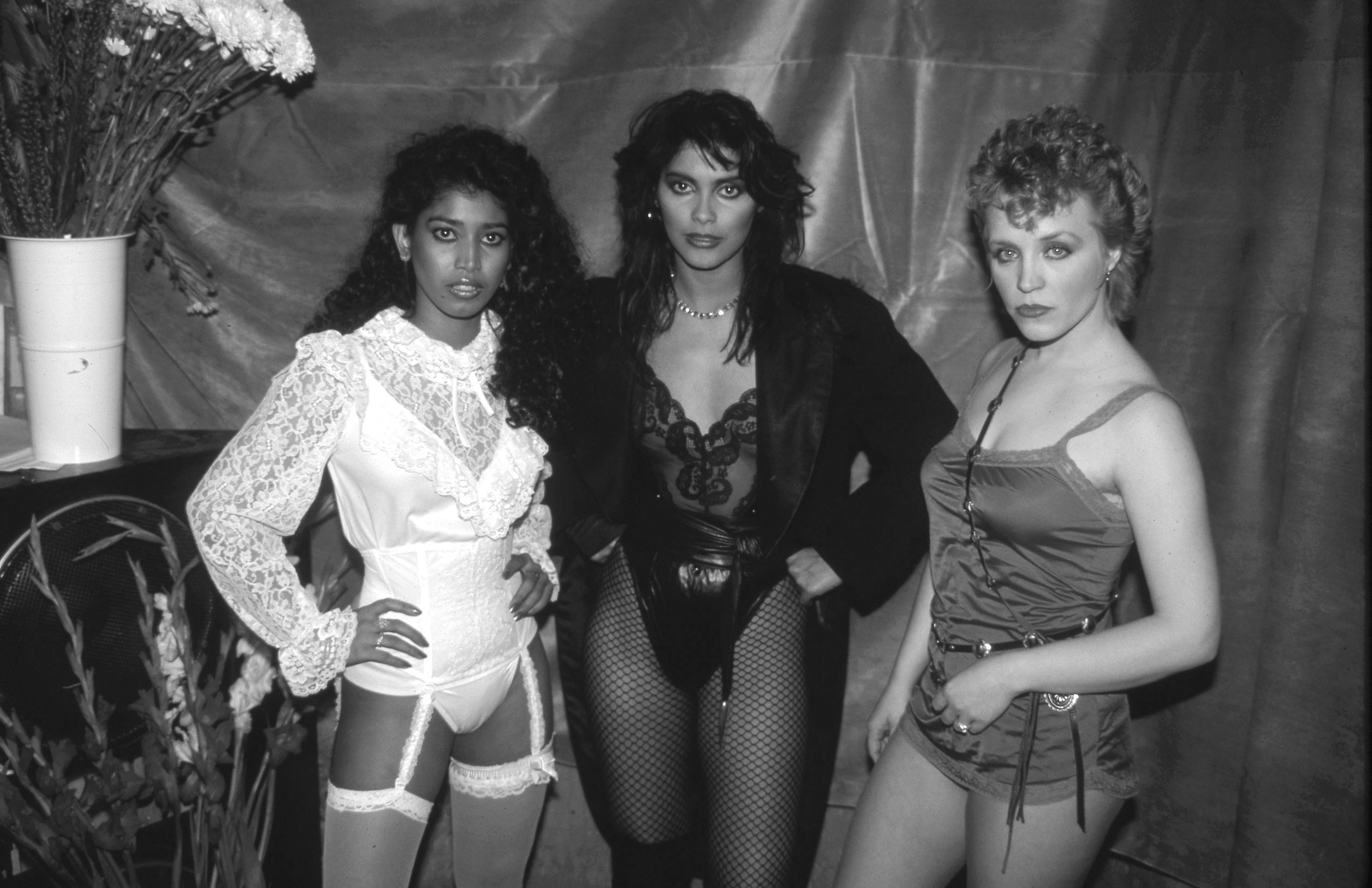 Vanity 6 near some flowers