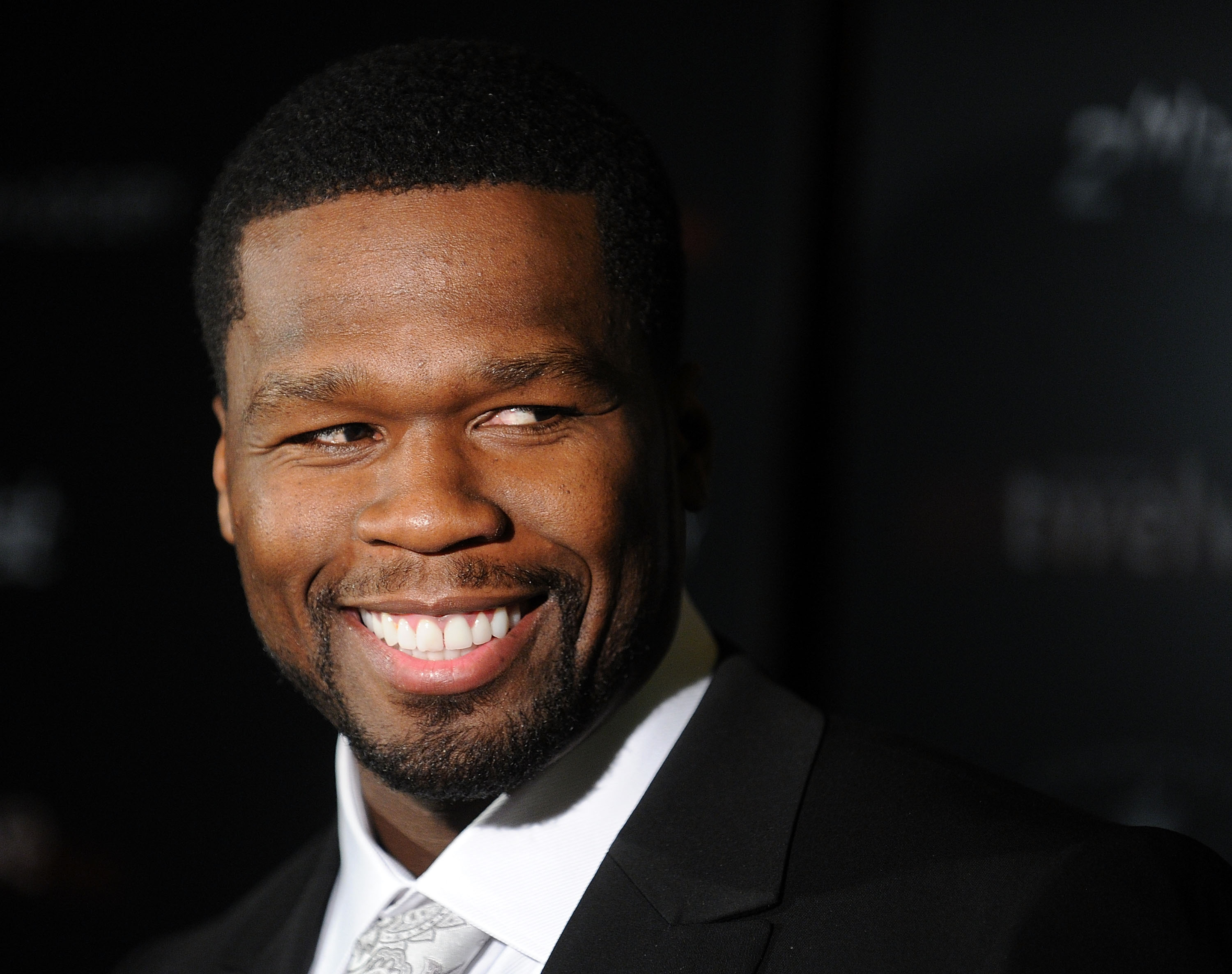 50 Cent wearing a suit and tie