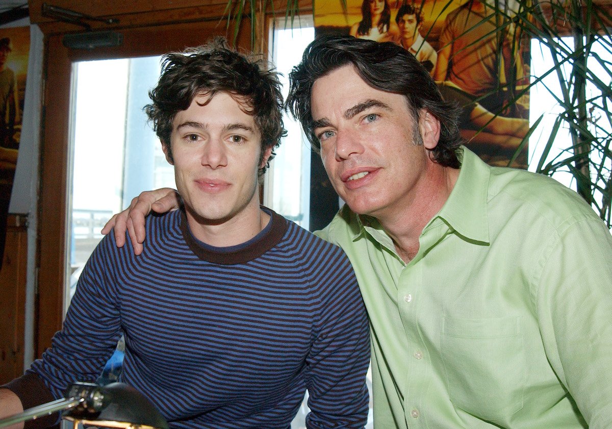 Adam Brody and Peter Gallagher pose together during a radio interview with the cast of 'The O.C.'