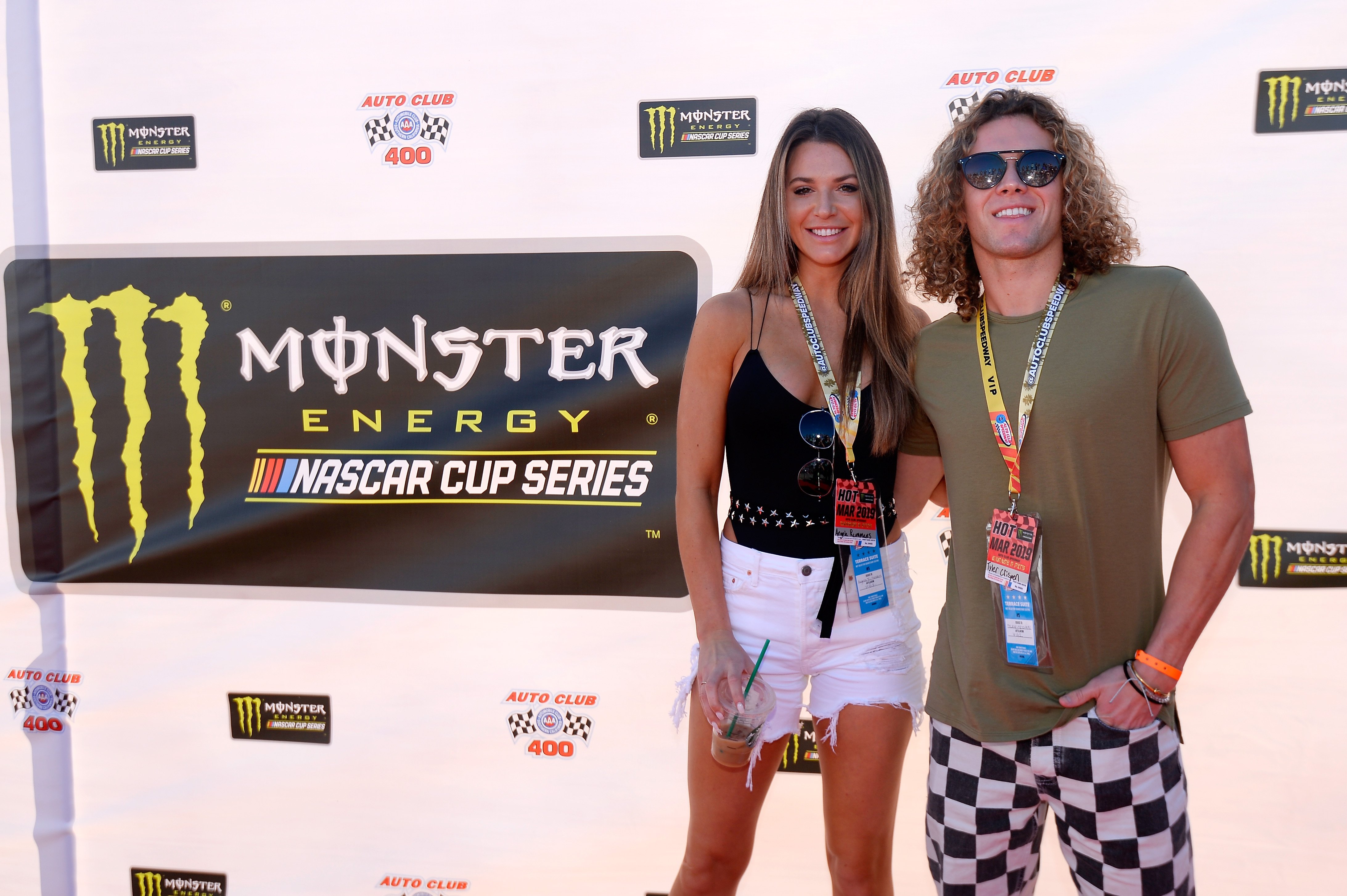 Angela Rummans and Tyler Crispen attend the driver's meeting prior to the Monster Energy NASCAR Cup Series Auto Club 400 at Auto Club Speedway