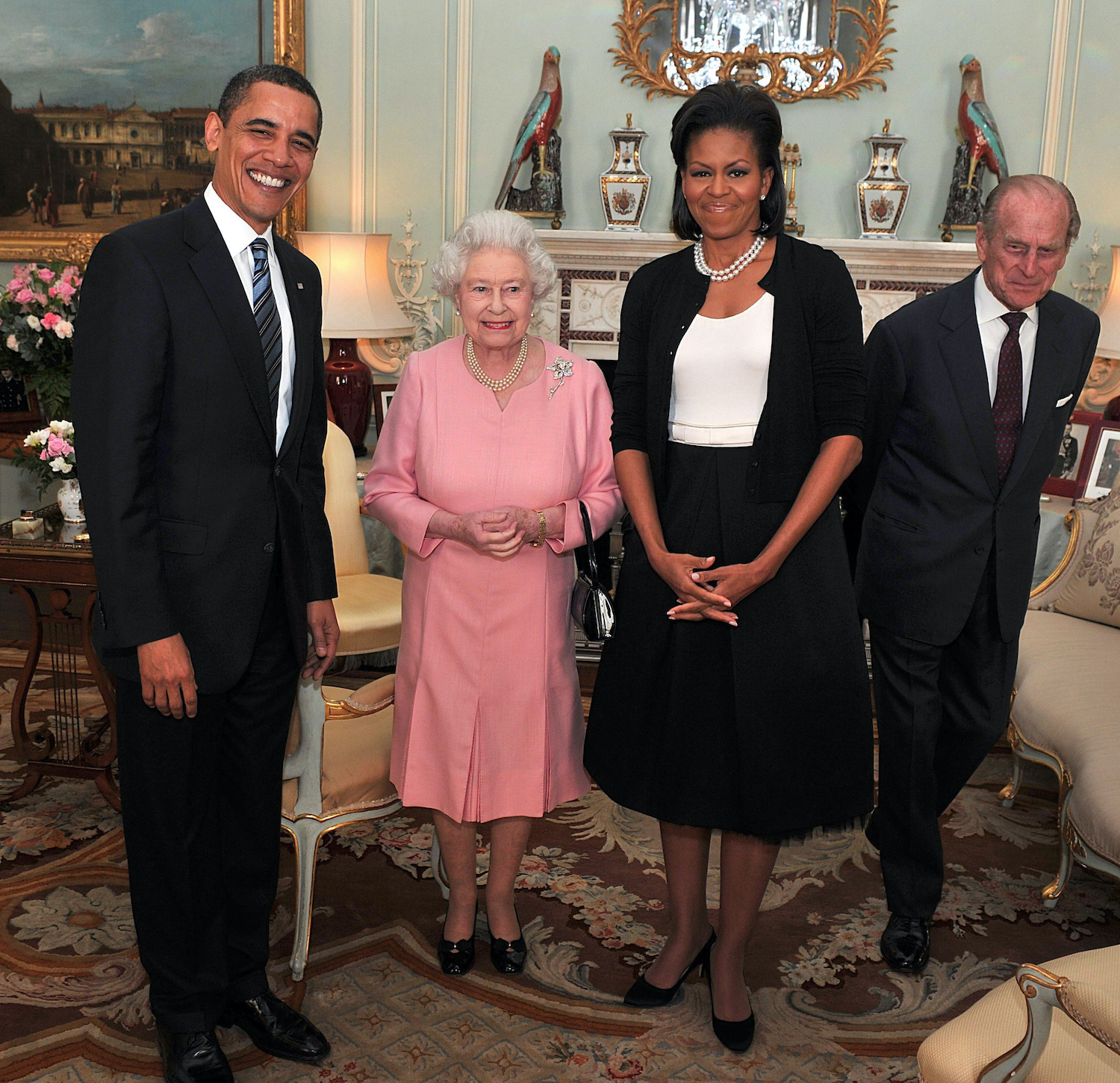 Barack Obama, Queen Elizabeth II, Michelle Obama, and Prince Philip pose for a photo at Buckingham Palace
