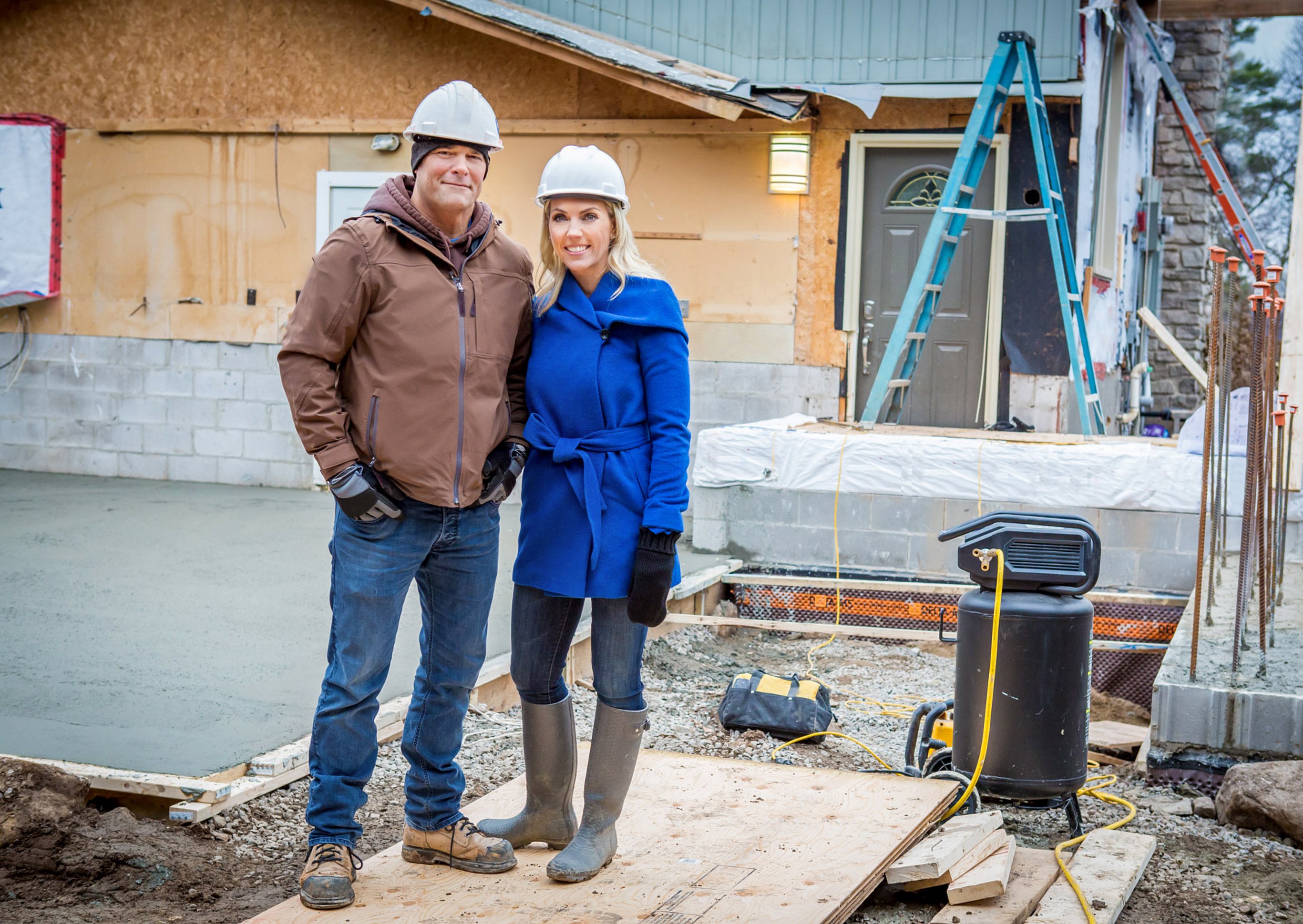 Bryan and Sarah Baeumler wearing hard hats
