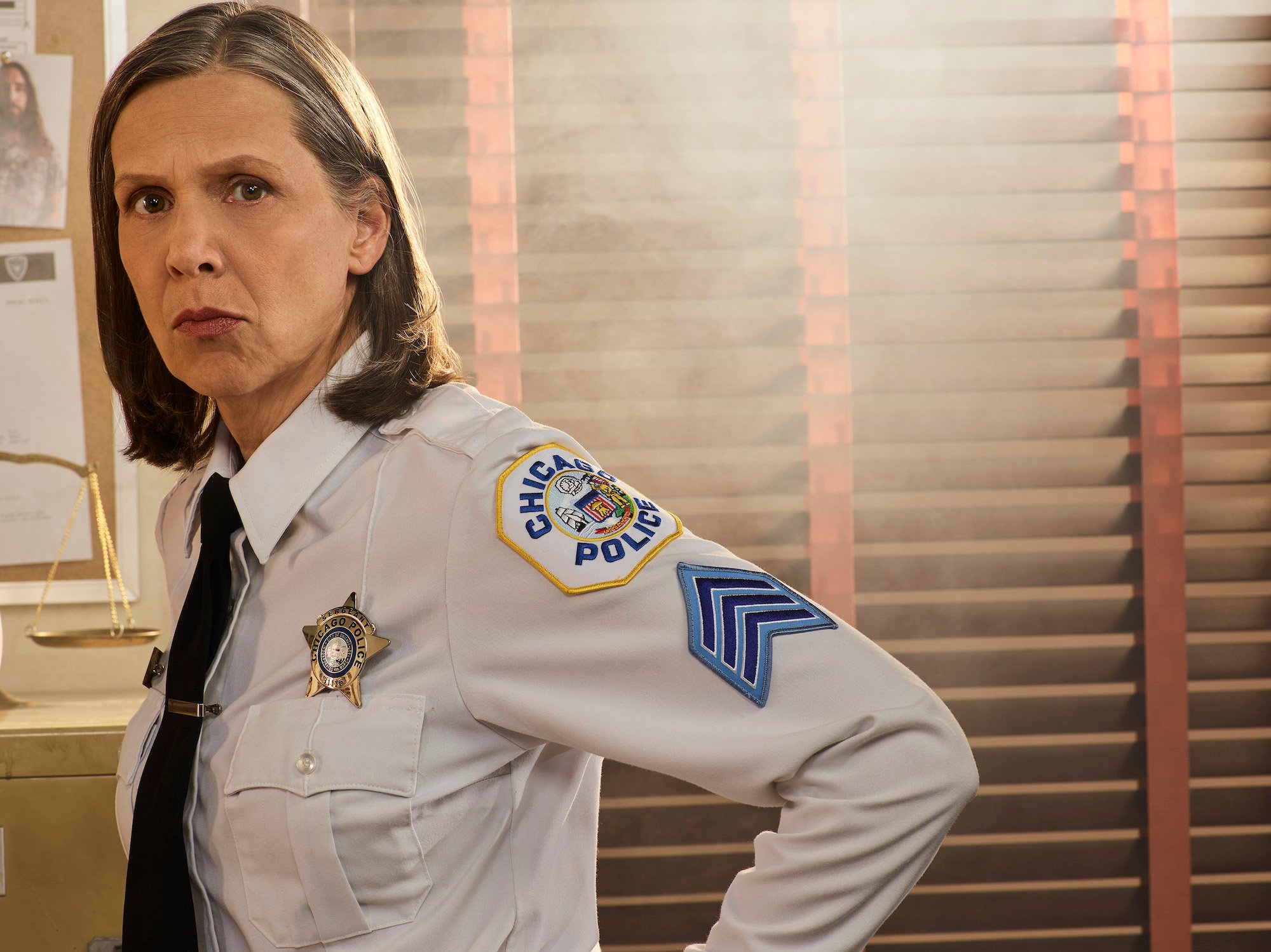 Amy Morton as Sgt. Trudy Platt, looking at the camera, not smiling